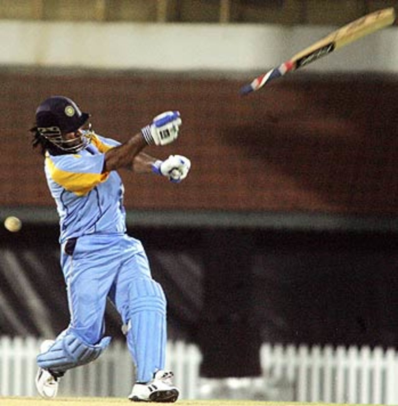 The bat flies off Mahendra Singh Dhoni's gloves while attempting a slog India Blue v India Green, Challenger Series, Chennai, October 2, 2006