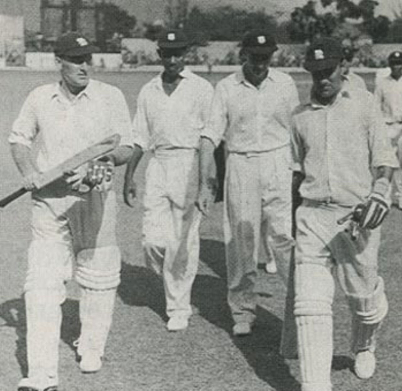 Len Hutton, having recorded the highest score by an England captain in a Test match of 205, and Johnny Wardle return to the pavilion for the tea interval during their seventh-wicket partnership of 102 in the fifth Test at Sabina Park, Jamaica, eventually won by England to square the series, March 1954