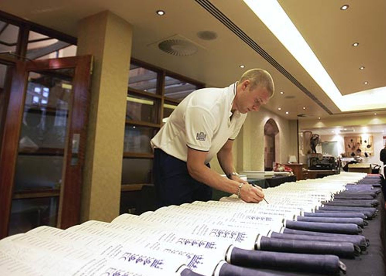 Andrew Flintoff signs bats, October 2006