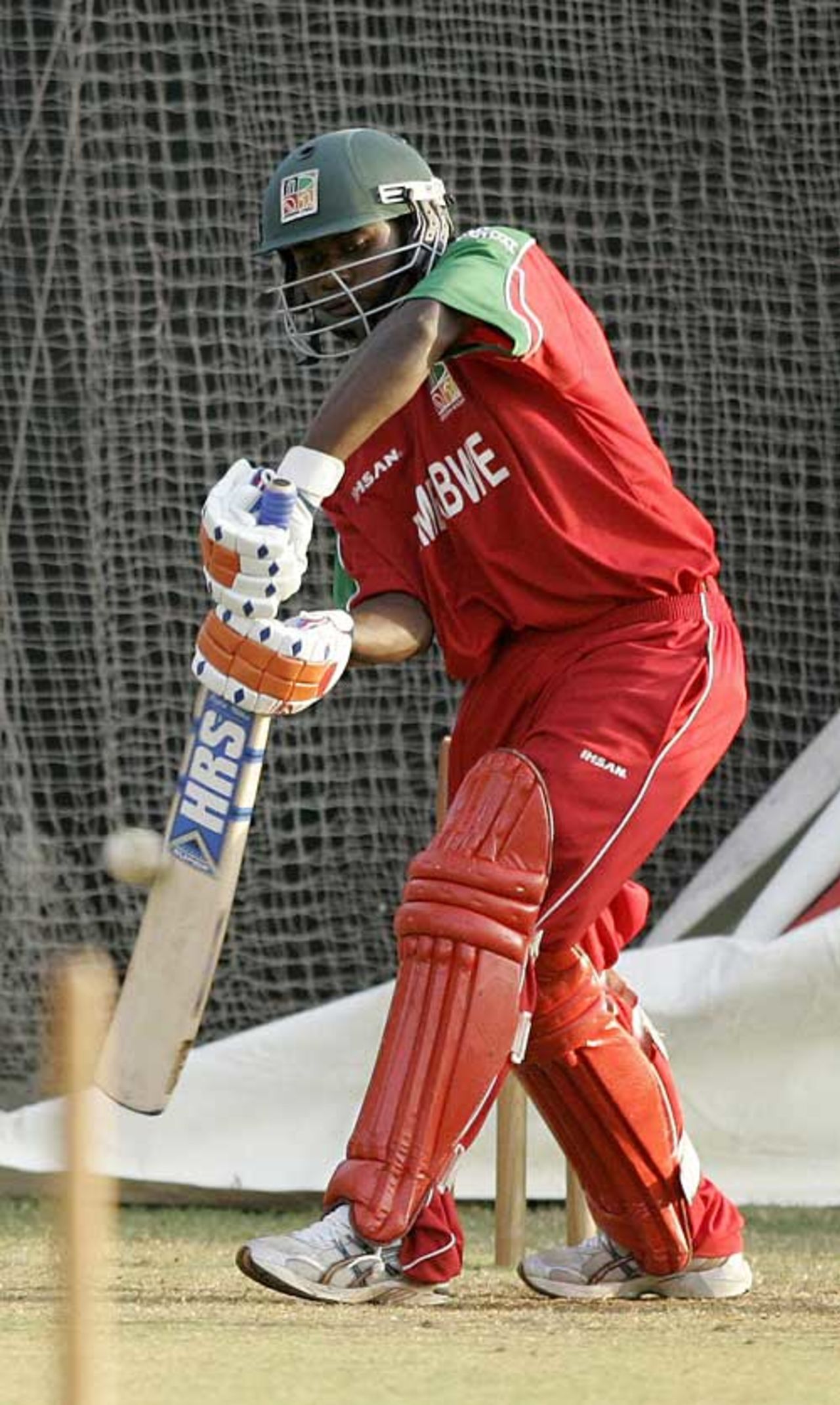 Prosper Utseya hits out during a net session ahead of Zimbabwe's first match of the Champions Trophy, Ahmedabad, October 7, 2006