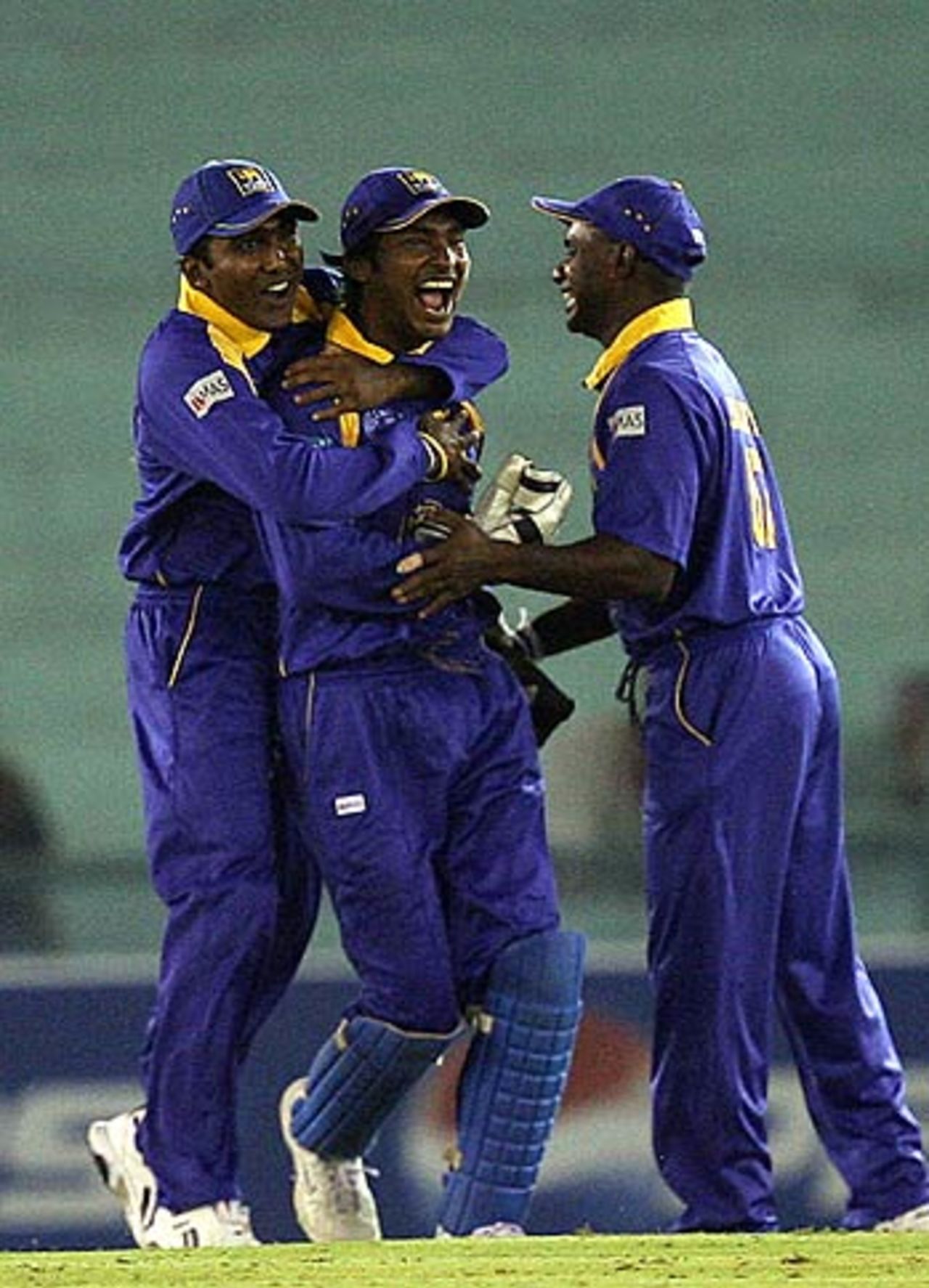 Mahela Jaywardene and Sanath Jayasuriya congratulate Kumar Sangakkara on a stunning catch to dismiss Shahriar Nafees, Bangladesh v Sri Lanka, 1st qualifying match, Champions Trophy, Mohali, October 7, 2006