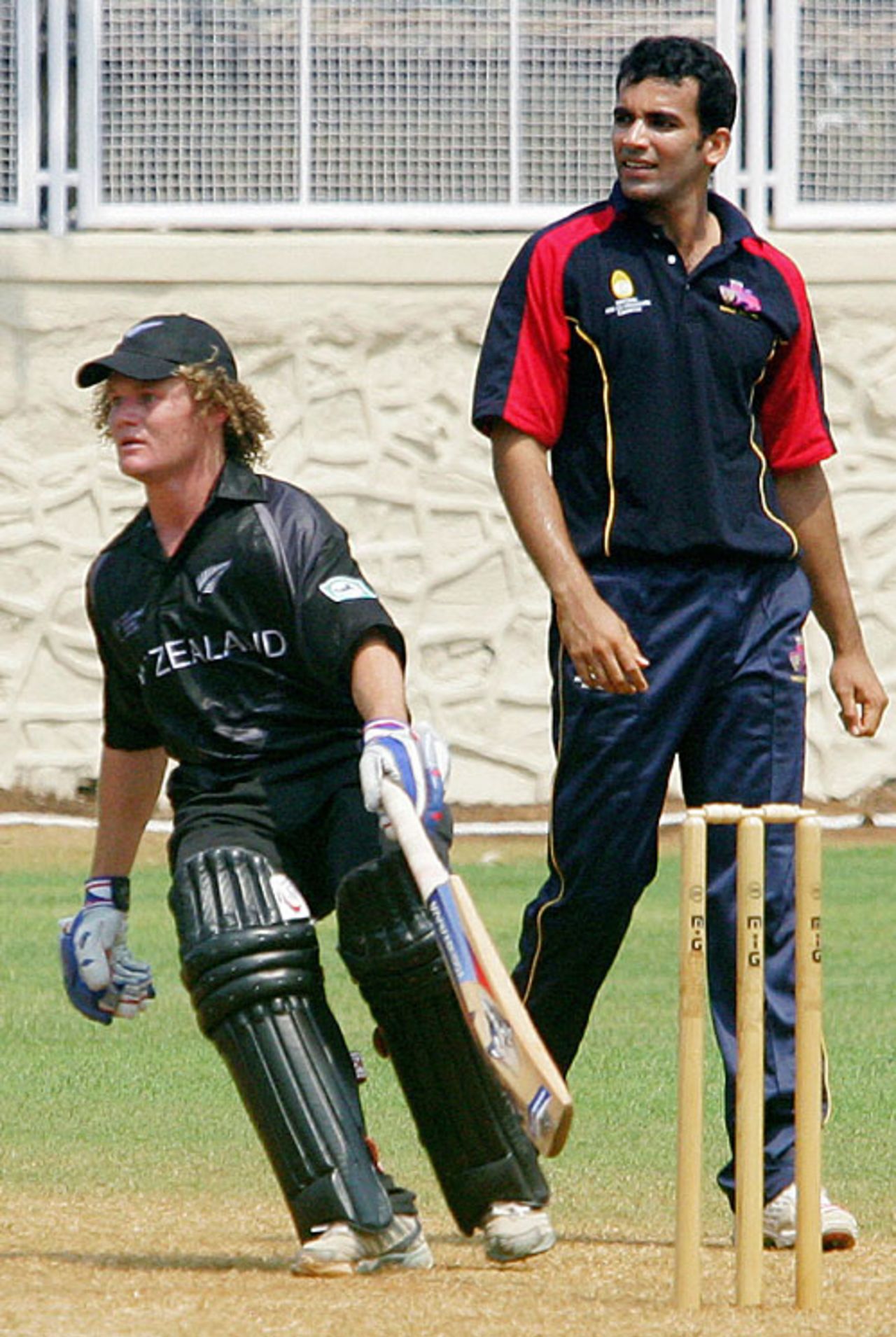 Hamish Marshall turns for a second as Zaheer Khan looks on, MCA President's XI v New Zealanders, Mumbai, October 12, 2006


