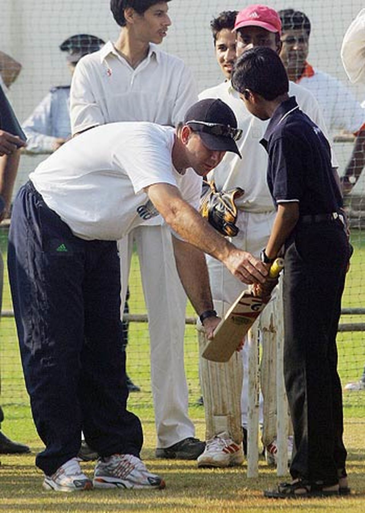 Ricky Ponting teaches a child the right way to hold a bat, October 2006