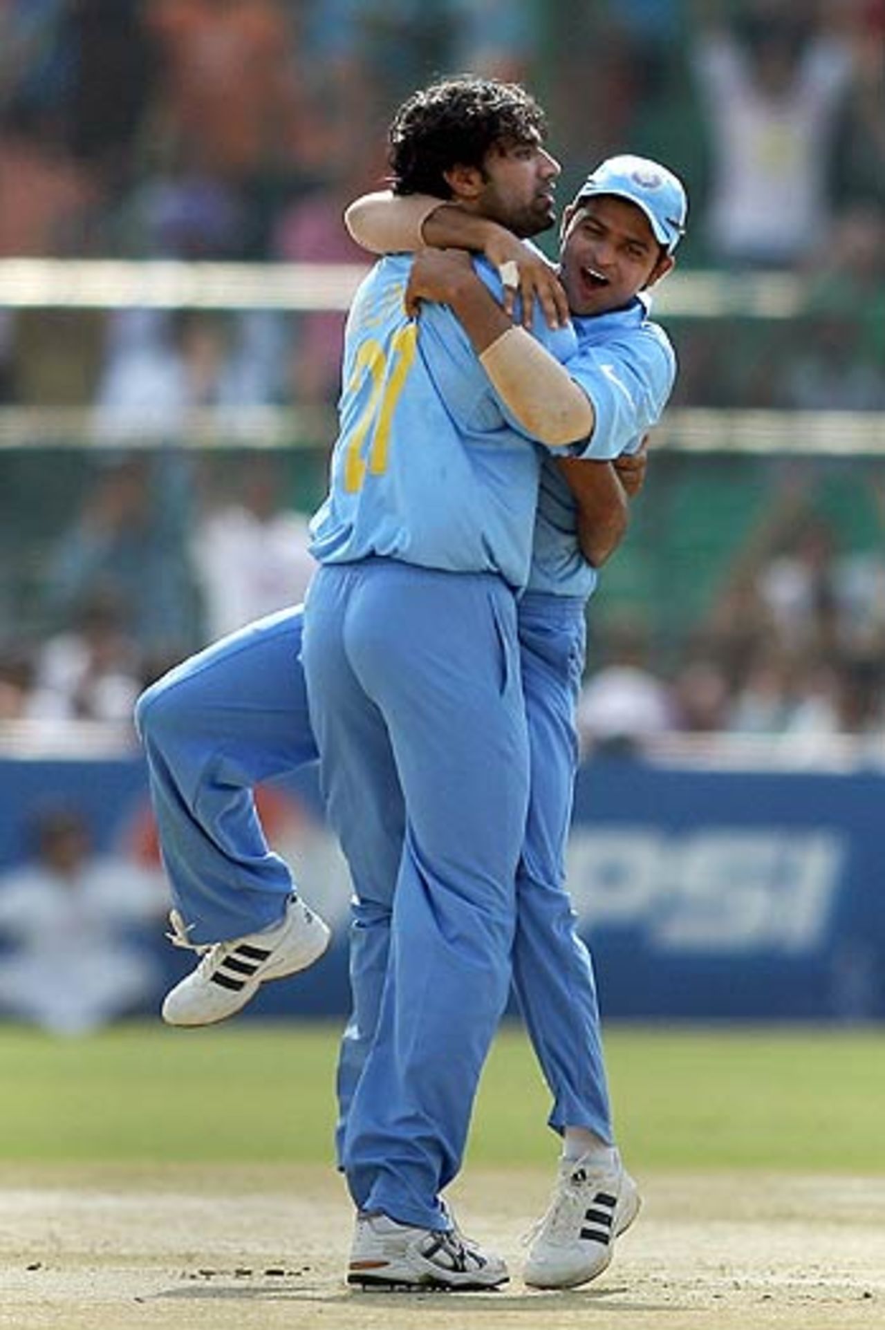 Suresh Raina clings to Munaf Patel at the fall of Michael Yardy's wicket, India v England, 1st match, Champions Trophy, Sawai Mansingh Stadium, Jaipur, October 15, 2006