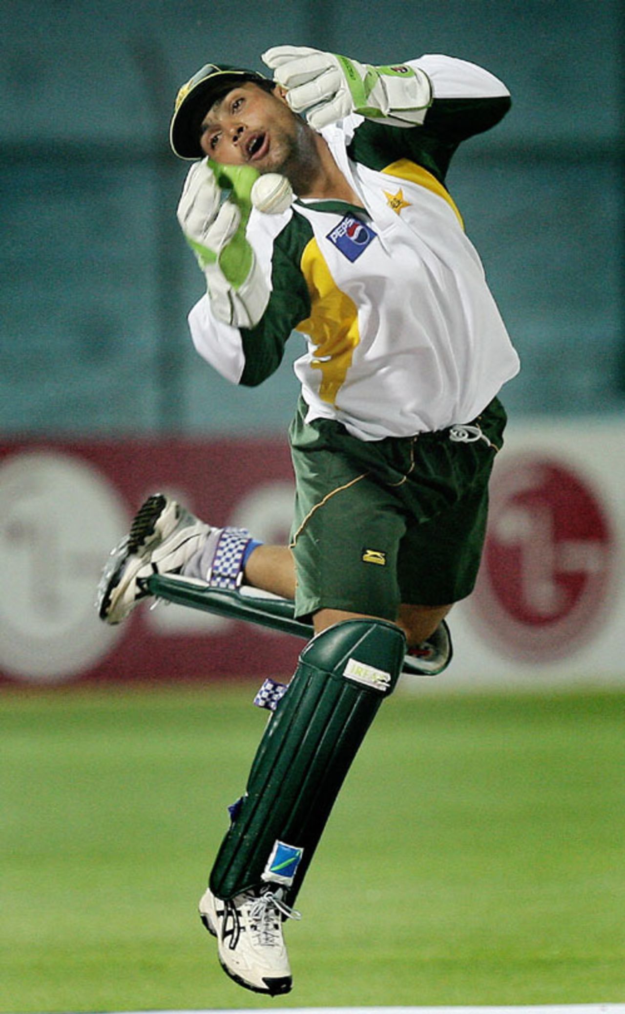 Kamran Akmal leaps to catch a ball during a practice session, Jaipur, October 16, 2006