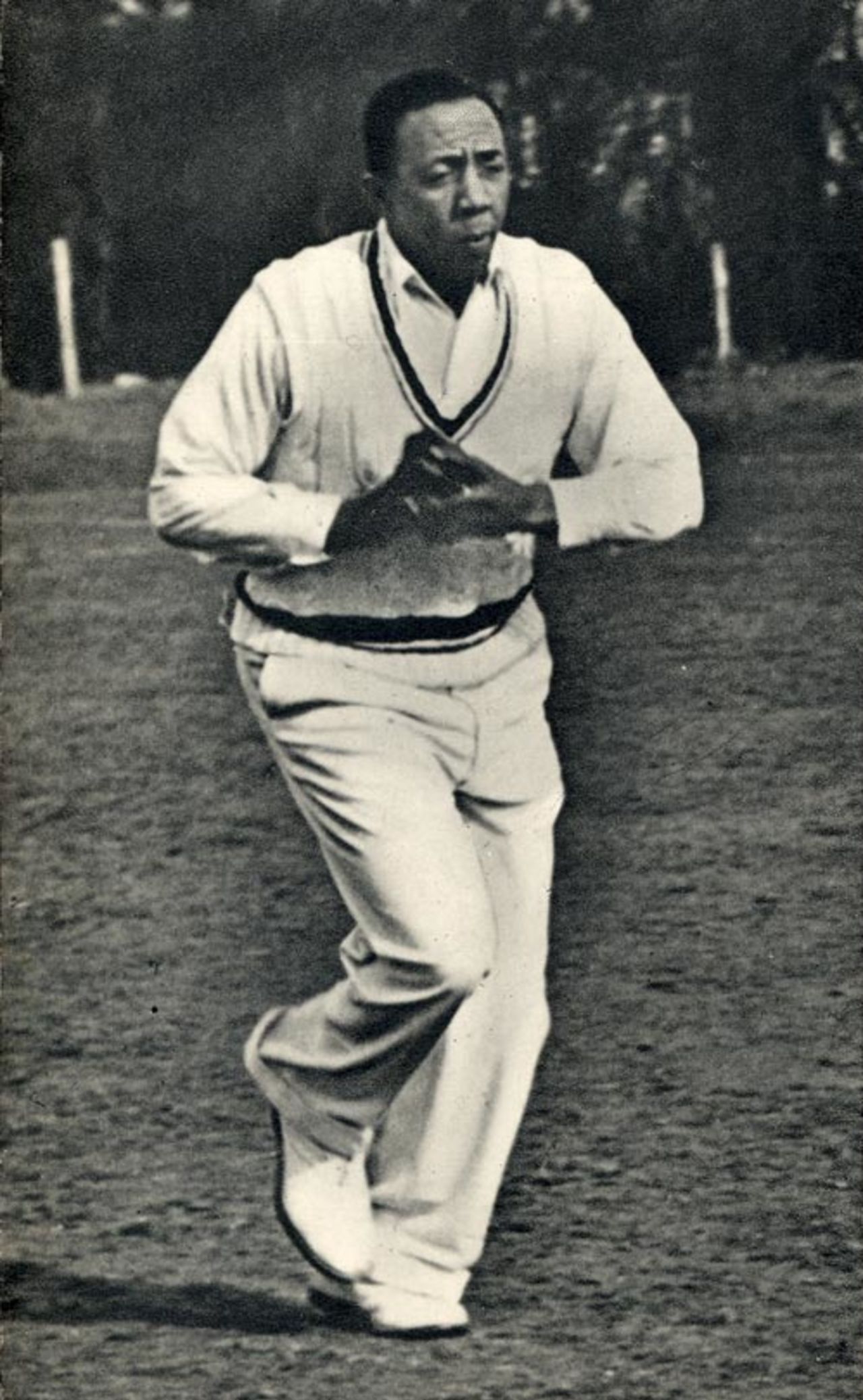 Learie Constantine runs in to bowl
