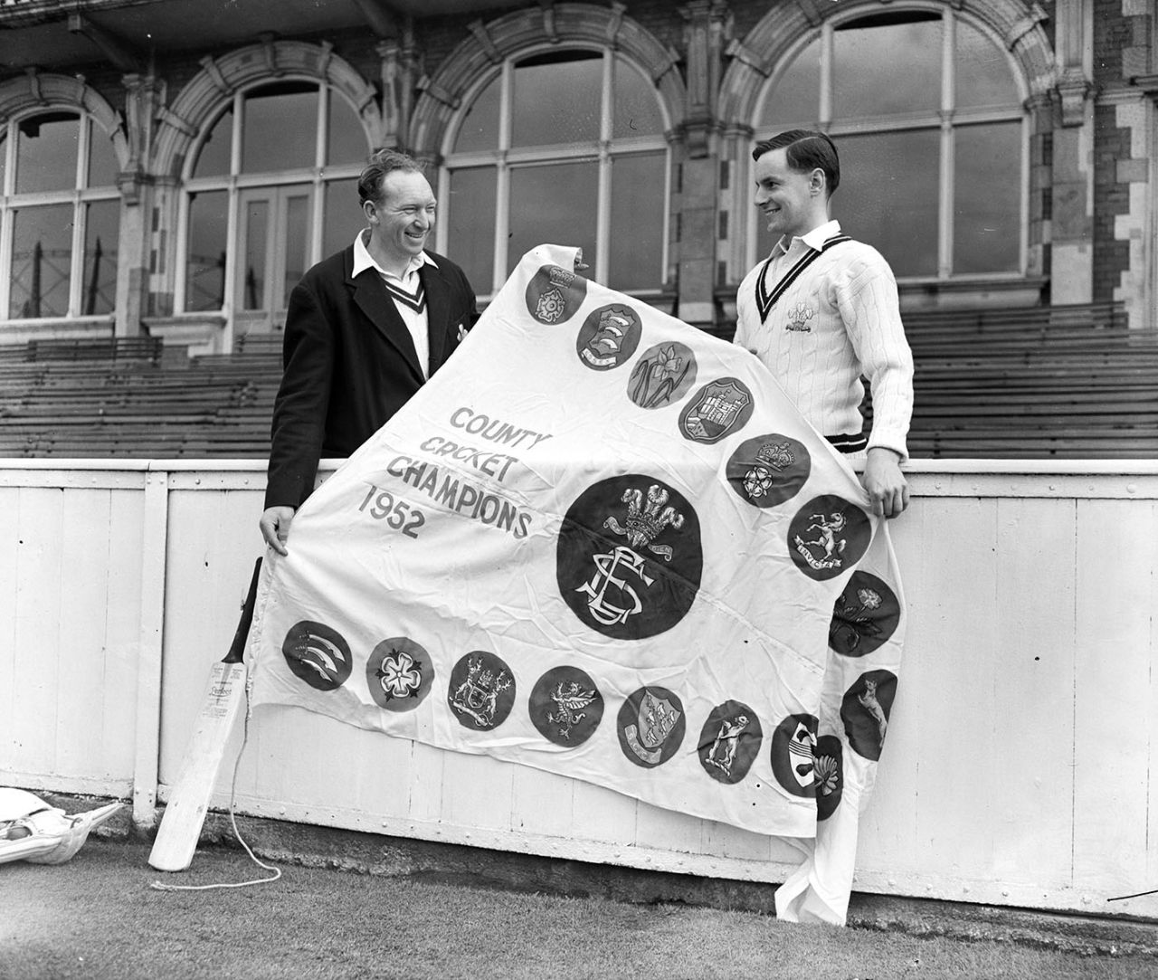 Stuart Surridge and Peter May pose with the 1952 Championship pennant, The Oval