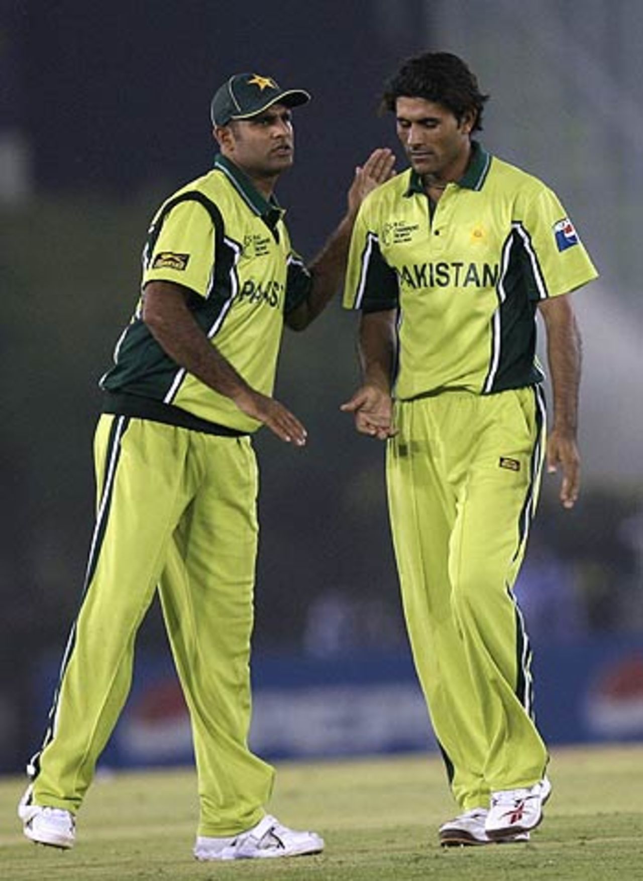 Rana Naved-ul-Hasan congratulates Abdul Razzaq for getting rid of Brendon McCullum, New Zealand v Pakistan, 8th match, Mohali, Champions Trophy, October 25, 2006