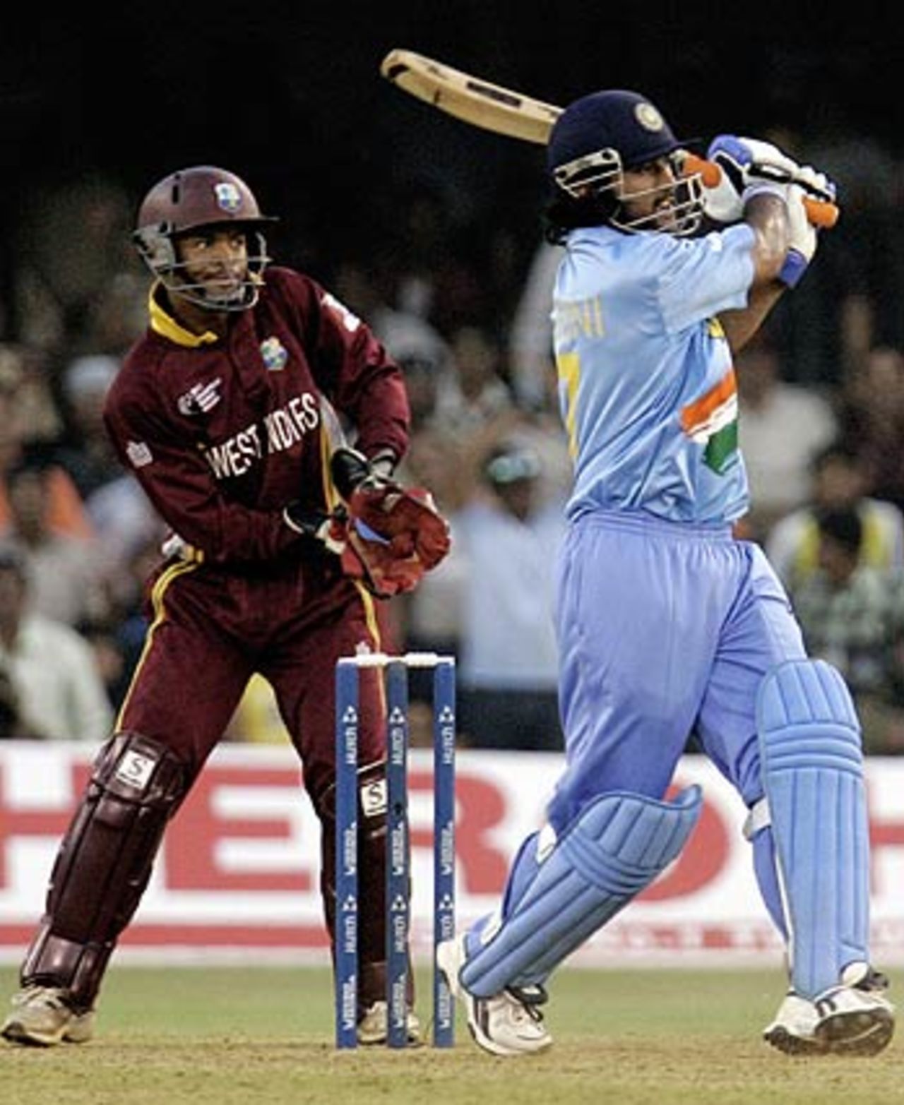Mahendra Singh Dhoni smashes a six over midwicket, India v West Indies, 9th match, Champions Trophy, Ahmedabad, October 26, 2006