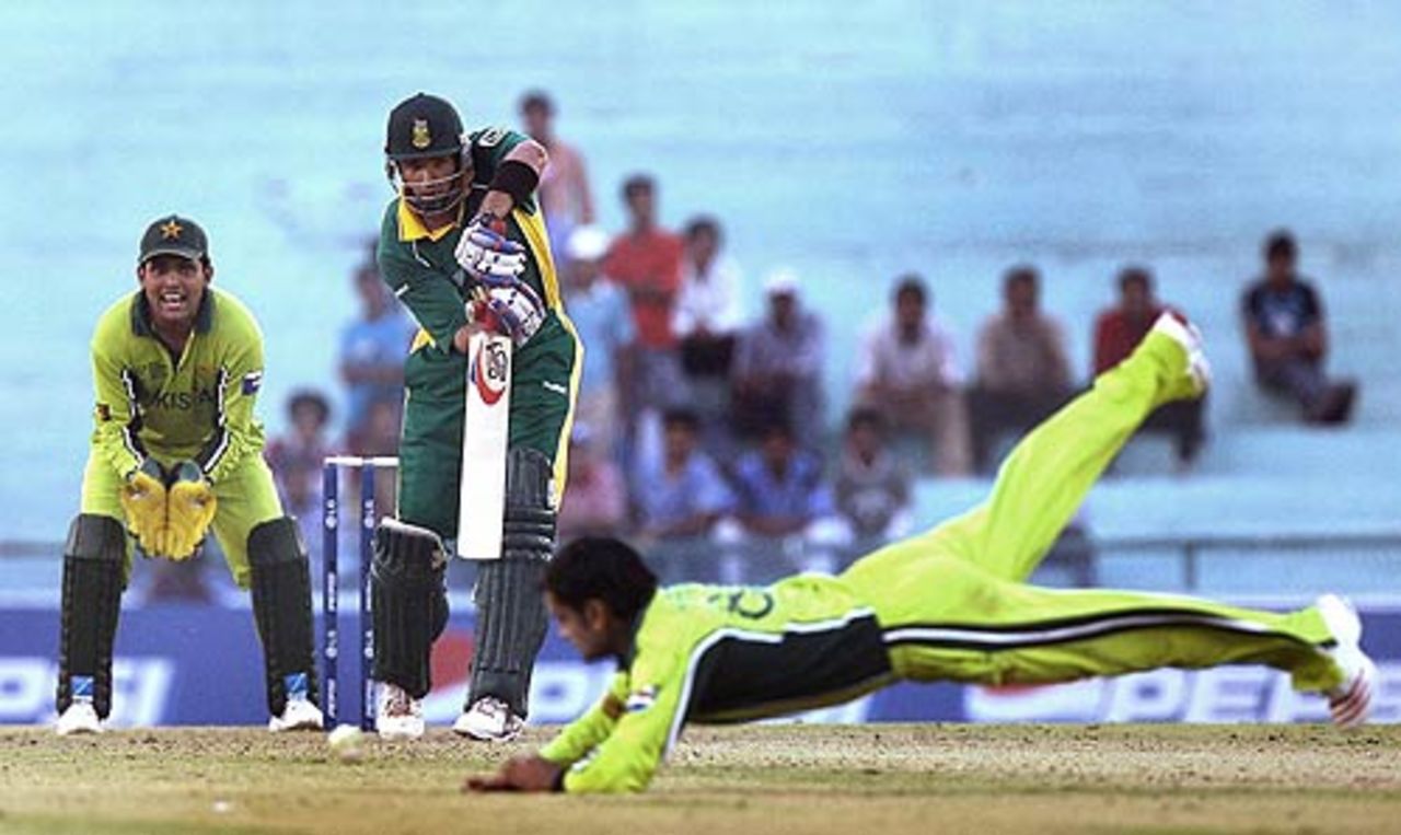 Mohammad Hafeez dives to stop a drive from Justin Kemp, Pakistan v South Africa, Champions Trophy, 16th match, Mohali, October 27, 2006