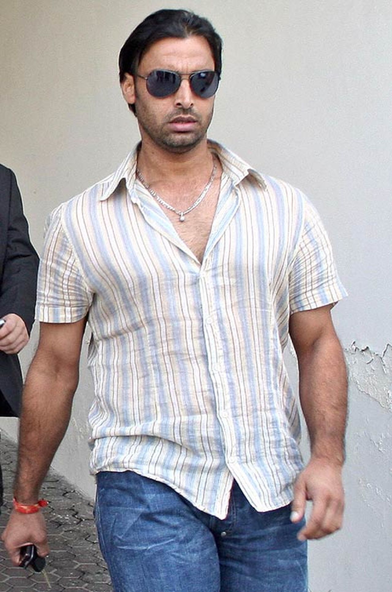 Shoaib Akhtar, who faces a two-year ban, leaves the doping hearing at the Gaddafi Stadium, Lahore, October 28, 2006