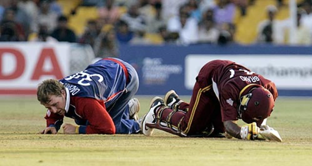 Jamie Dalrymple and Dwayne Bravo are winded after a collision, 17th match, Champions Trophy, Ahmedabad, October 28, 2006