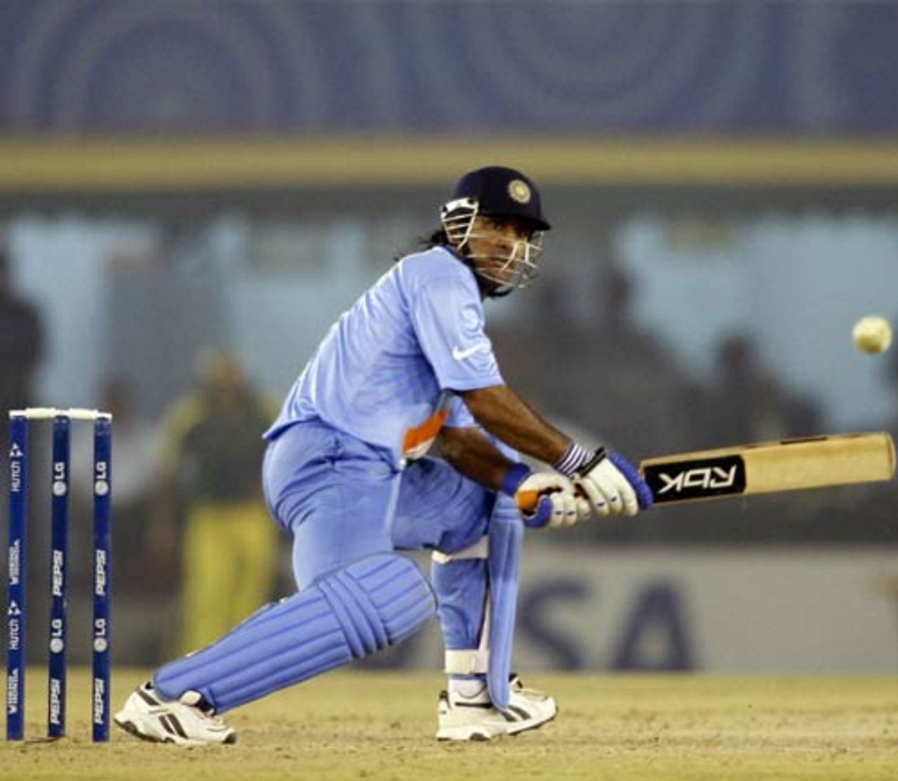 Cheeky ...  Mahendra Singh Dhoni reverse sweeps Nathan Bracken, India v Australia, 18th match, Champions Trophy, October 29, 2007