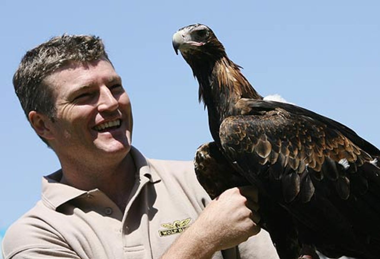 Stuart MacGill and the Wolf Blass Wedge-tailed Eagle get chatty during a promotional photo shoot at the SCG, Sydney, October 31, 2006