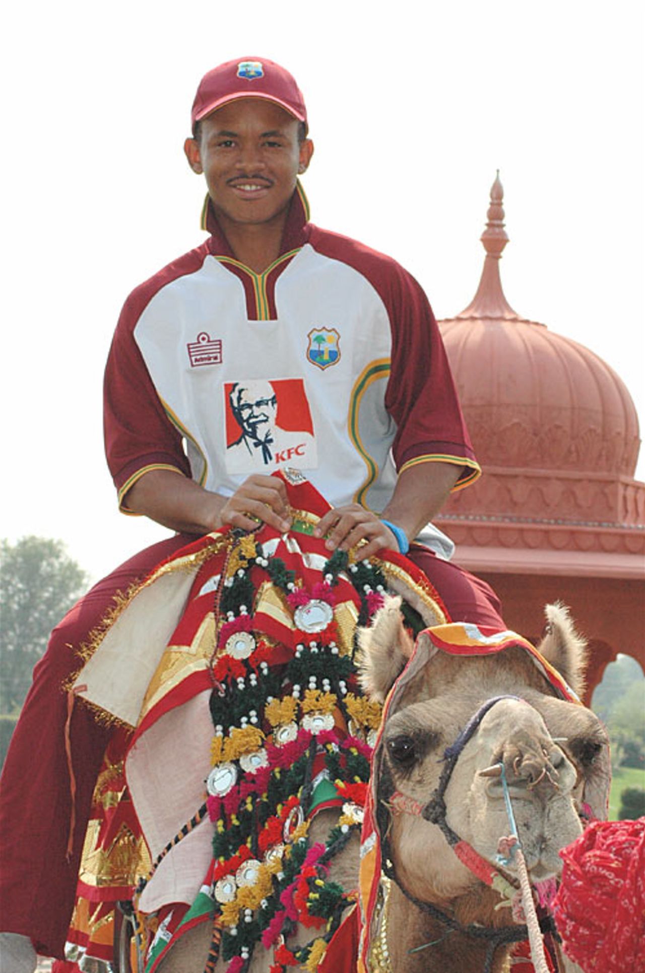 Carlton Baugh enjoys a camel ride after his team's training session, Jaipur, October 31, 2006