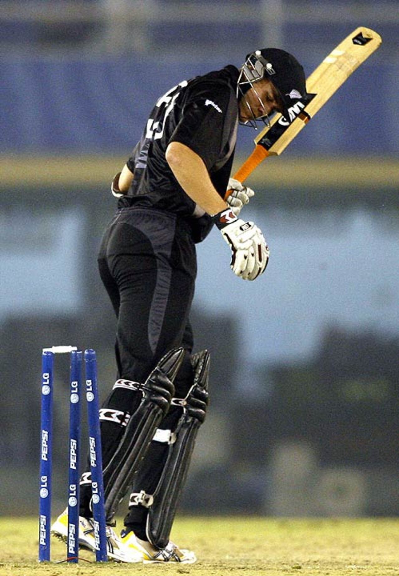 Peter Fulton pays for an error in judgement, bowled by Glenn McGrath, Australia v New Zealand, 1st semi-final, Champions Trophy, Mohali, November 1, 2006