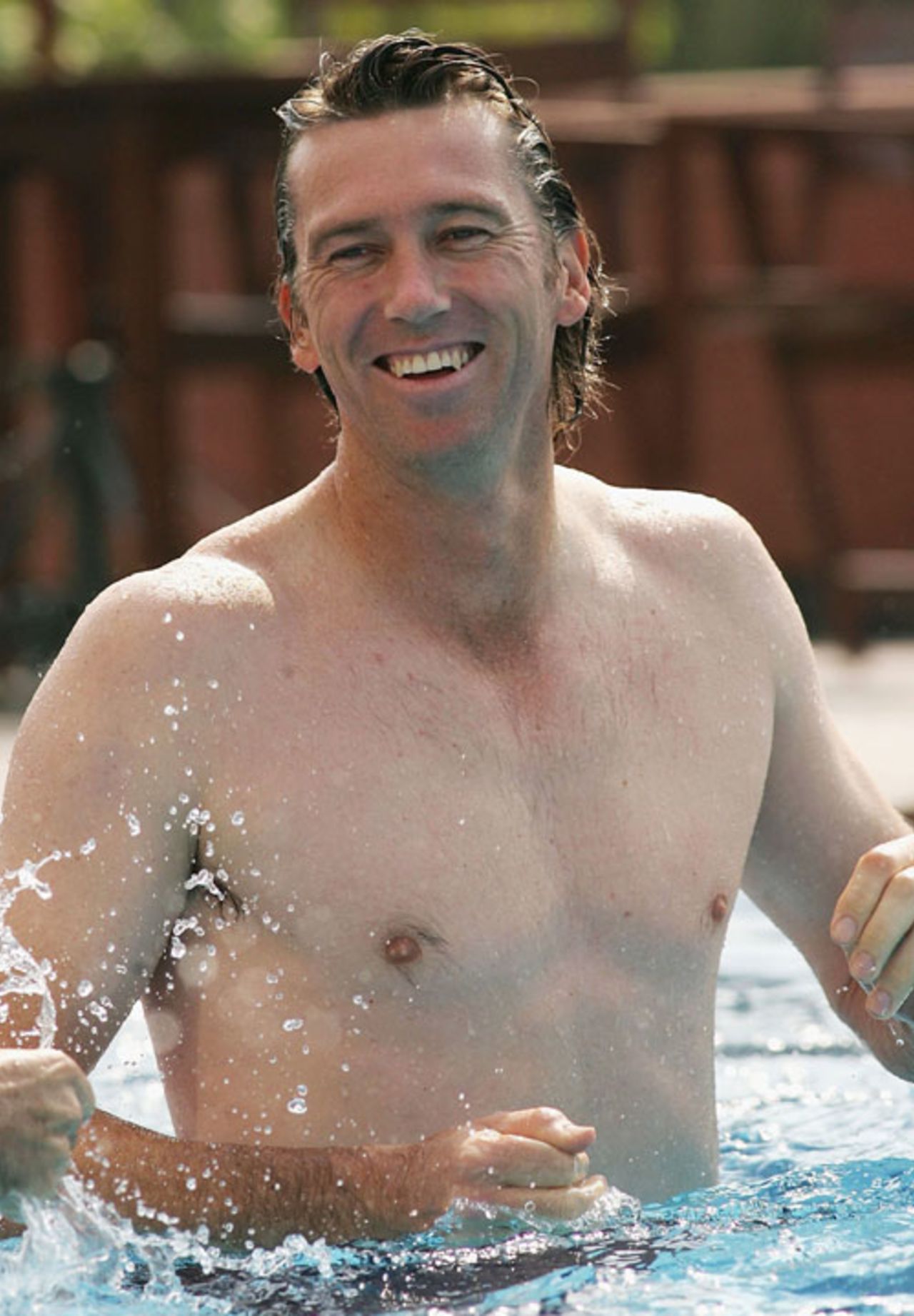 Splish splash: Glenn McGrath relaxes in the swimming pool, Chandigarh, November 2, 2006
