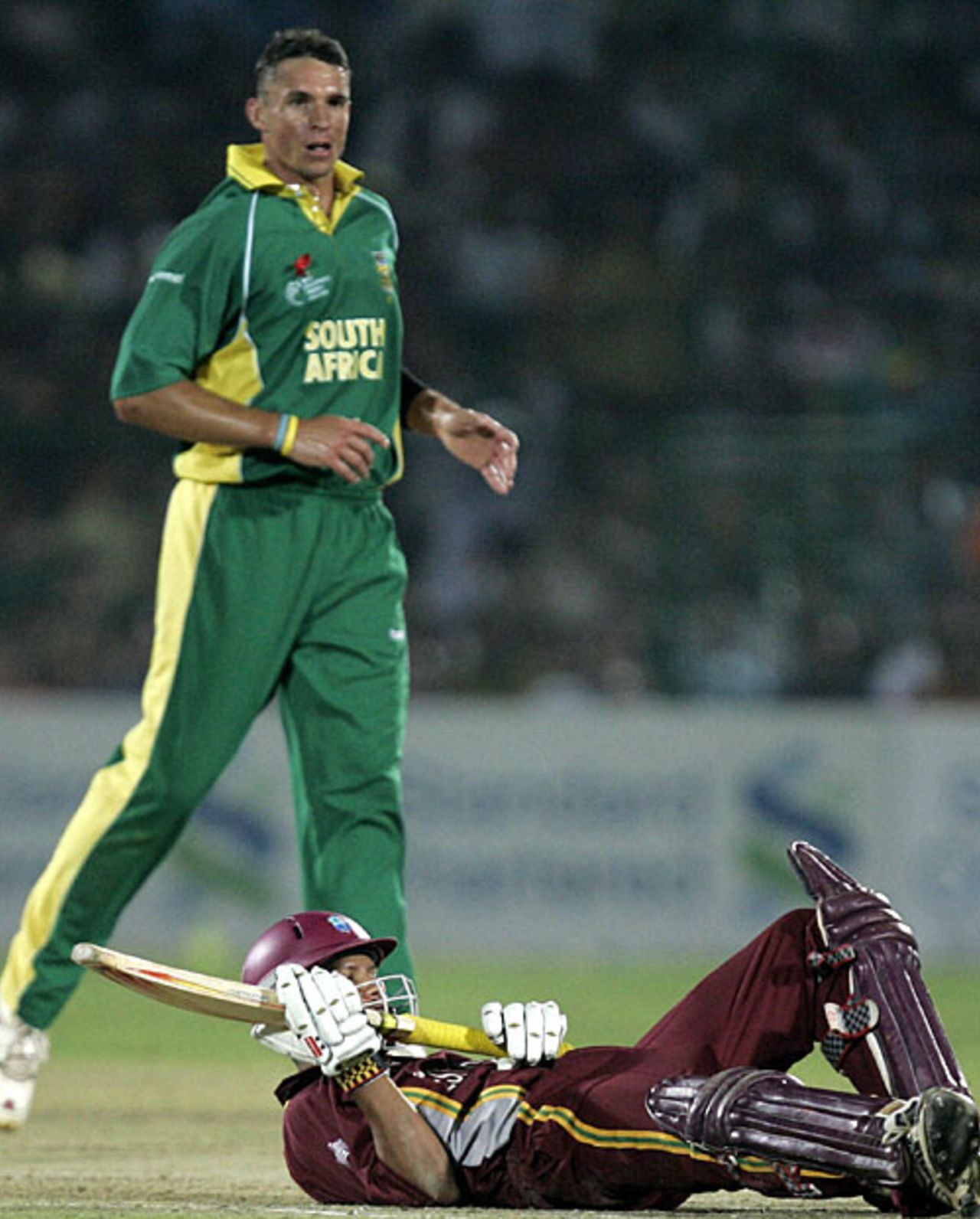 Down but not out: Andre Nel stands over a grounded Ramnaresh Sarwan, South Africa v West Indies, 2nd semi-final, Champions Trophy, Jaipur, November 2, 2006