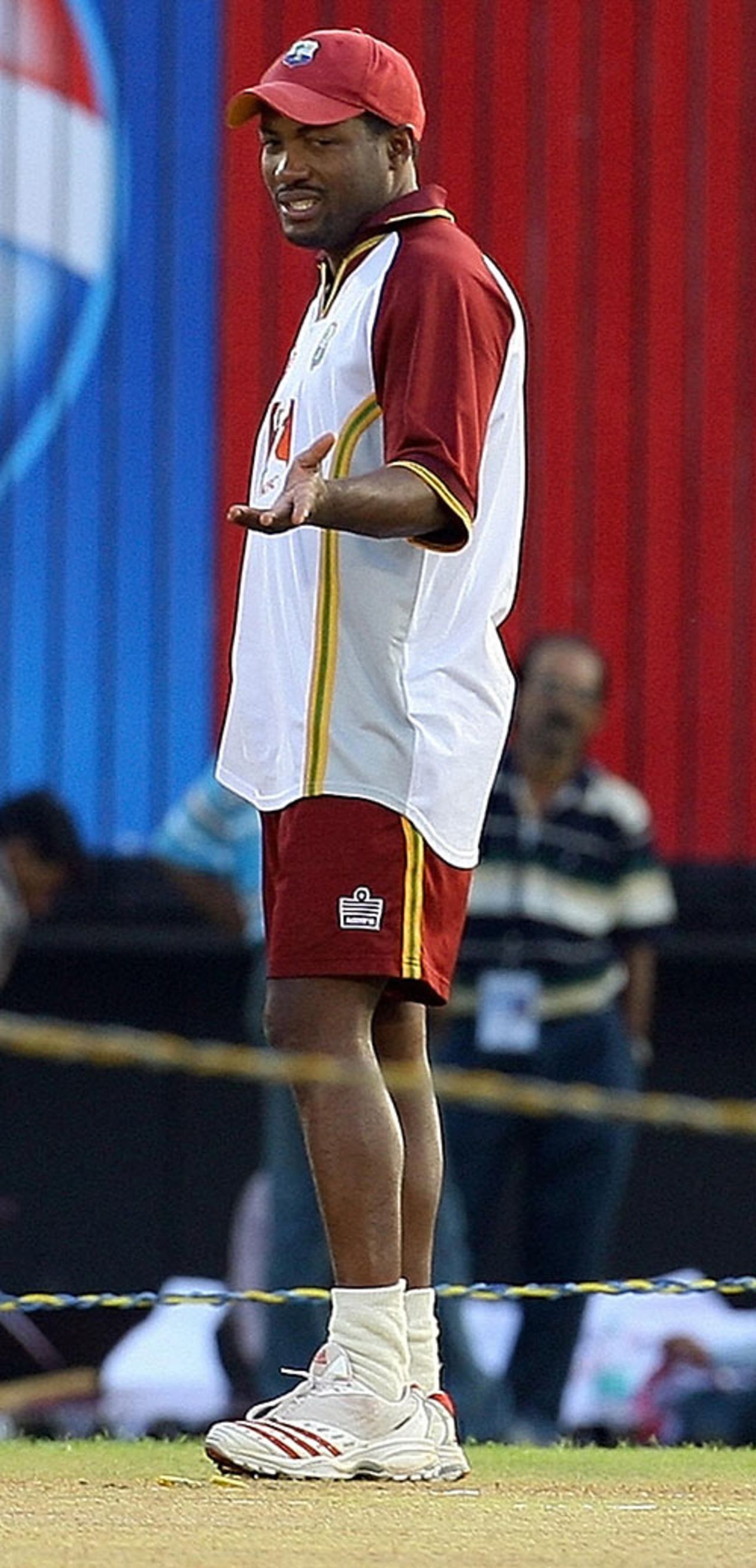Brian Lara assesses the pitch at Mumbai ahead of Sunday's ICC Champions Trophy final against Australia, Mumbai, November 4, 2006
