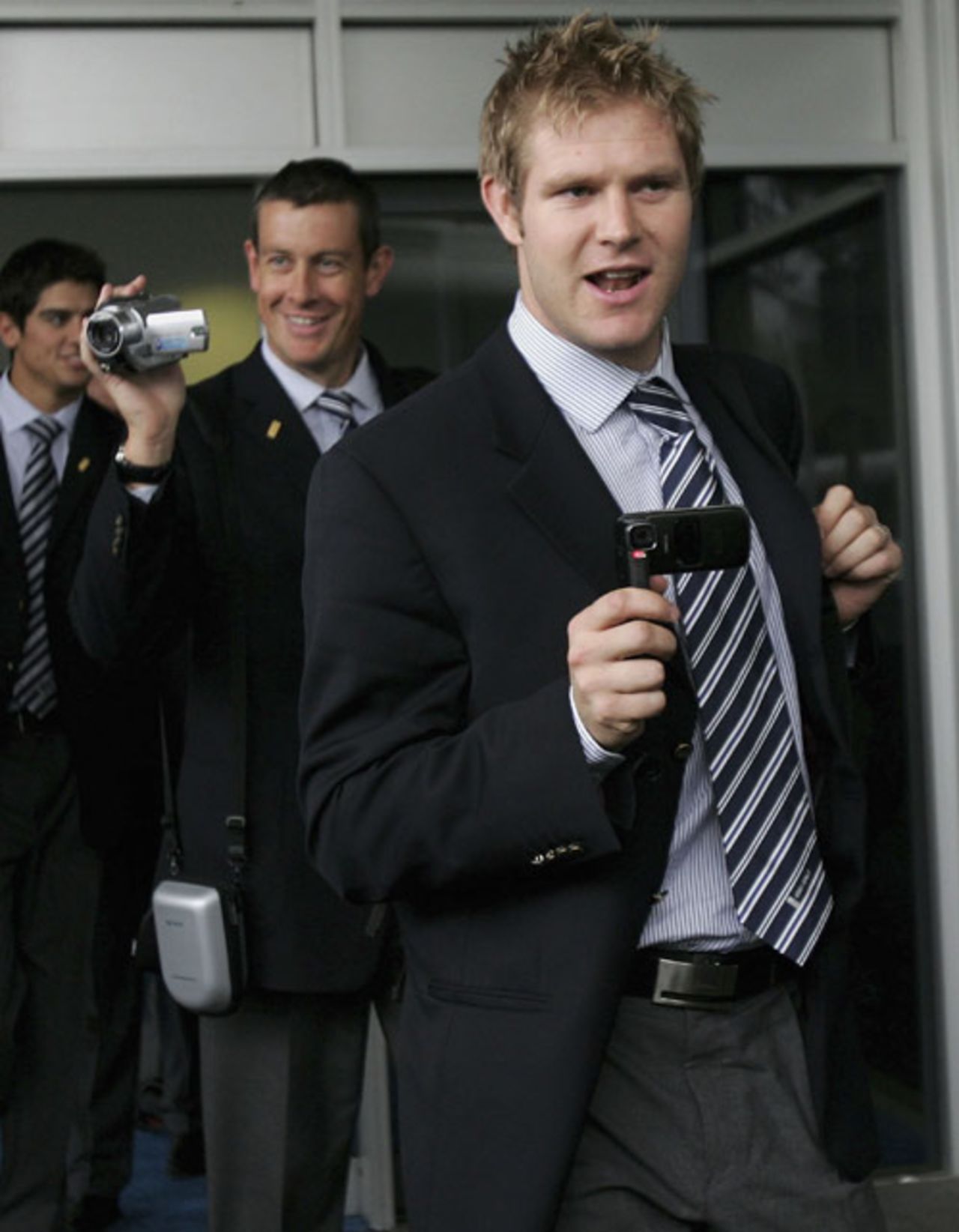 Matthew Hoggard and Ashley Giles (behind) film their arrival at Sydney airport for England's tour of Australia, Sydney, November 5, 2006
