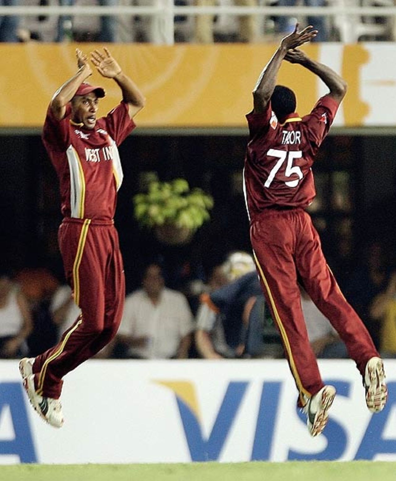 JeromeTaylor and Ian Bradshaw celebrate Ricky Ponting's wicket, West Indies v Australia, Champions Trophy final, Mumbai, November 5, 2006