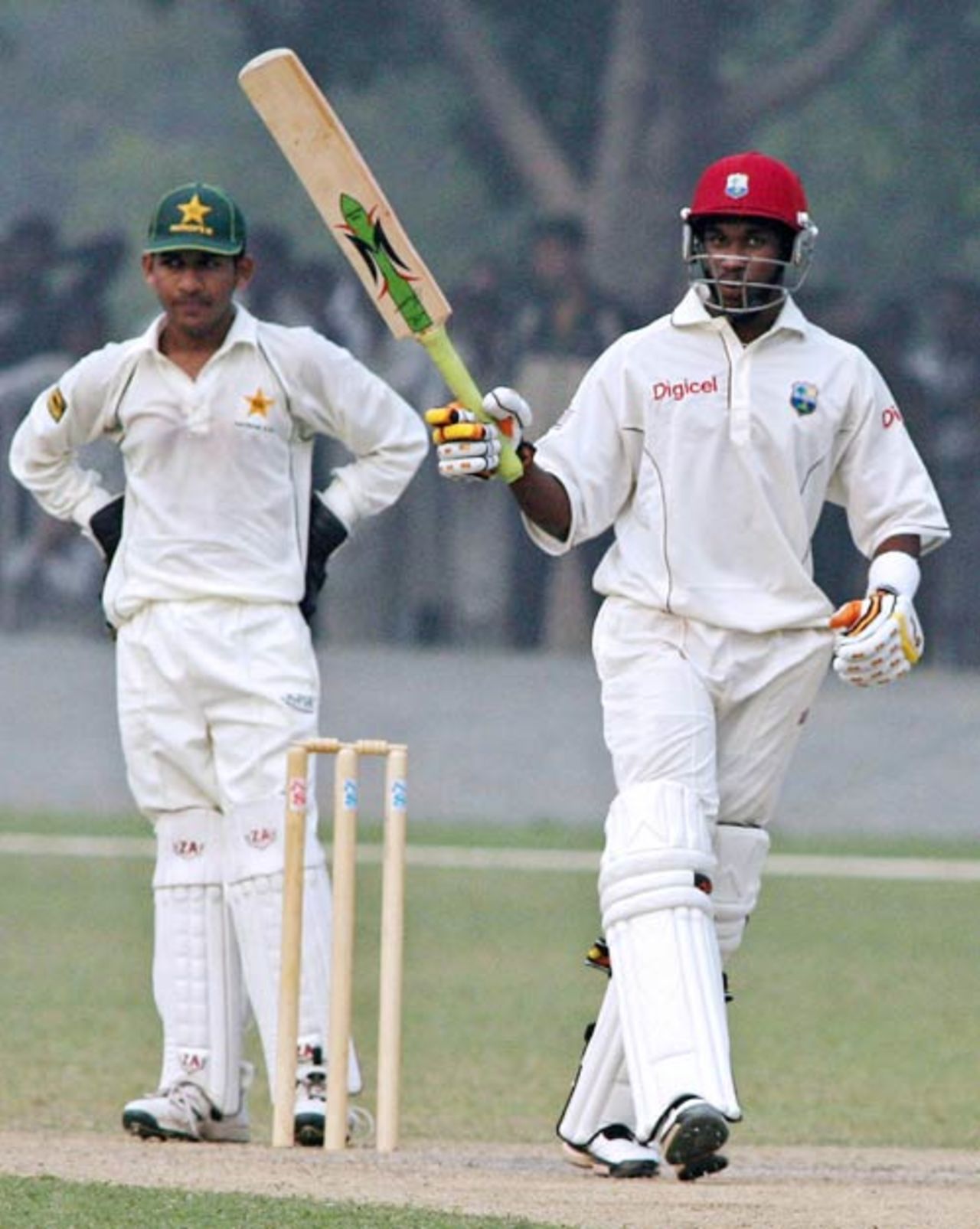 Dwayne Bravo salutes his century during a warm-up game against the Patron's XI, Lahore, November 9, 2006