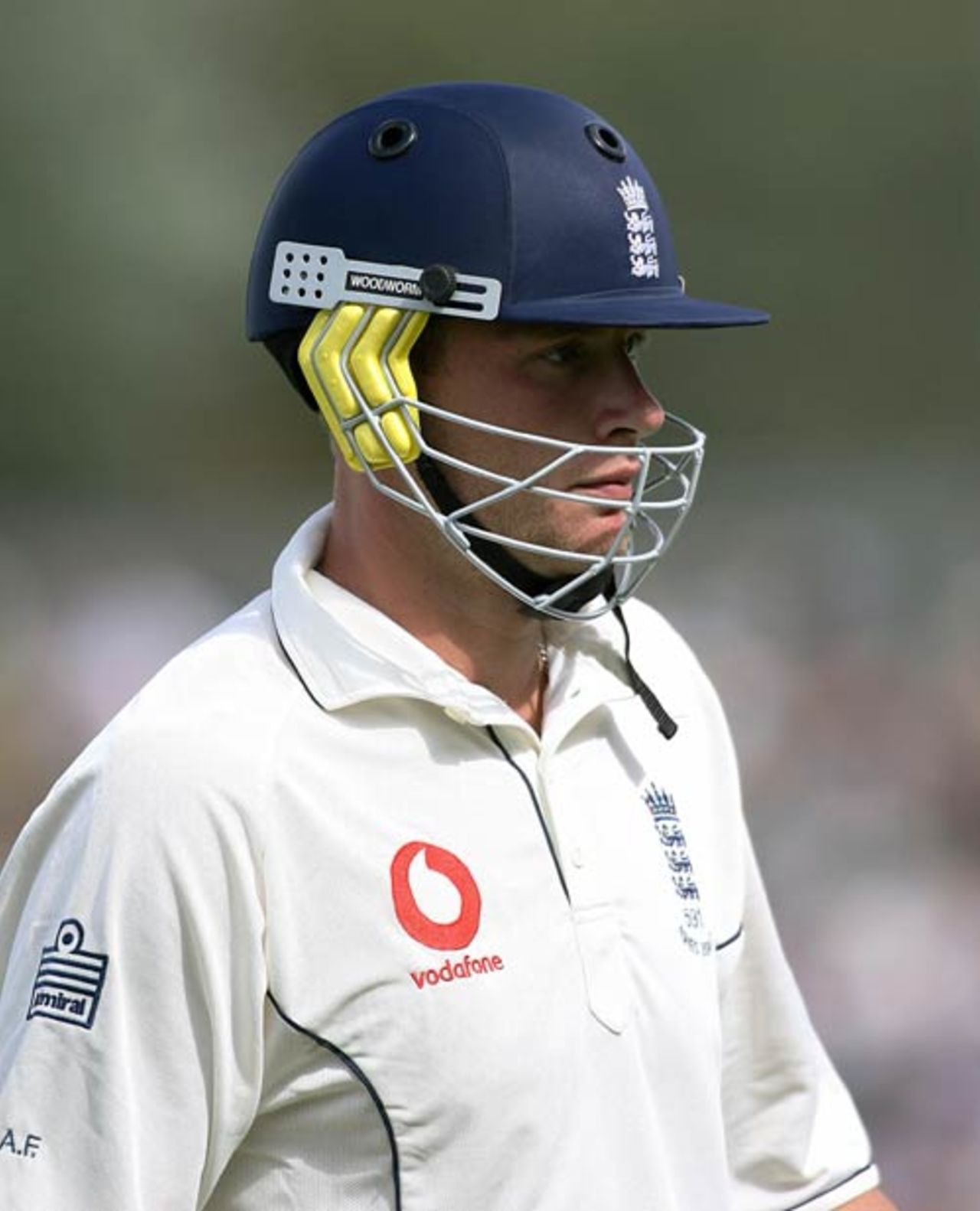Andrew Flintoff trudges off after being dismiseed for a single during the first Ashes tour match between the Australian Prime Minister's XI and England at Manuka Oval in Canberra, November 10, 2006