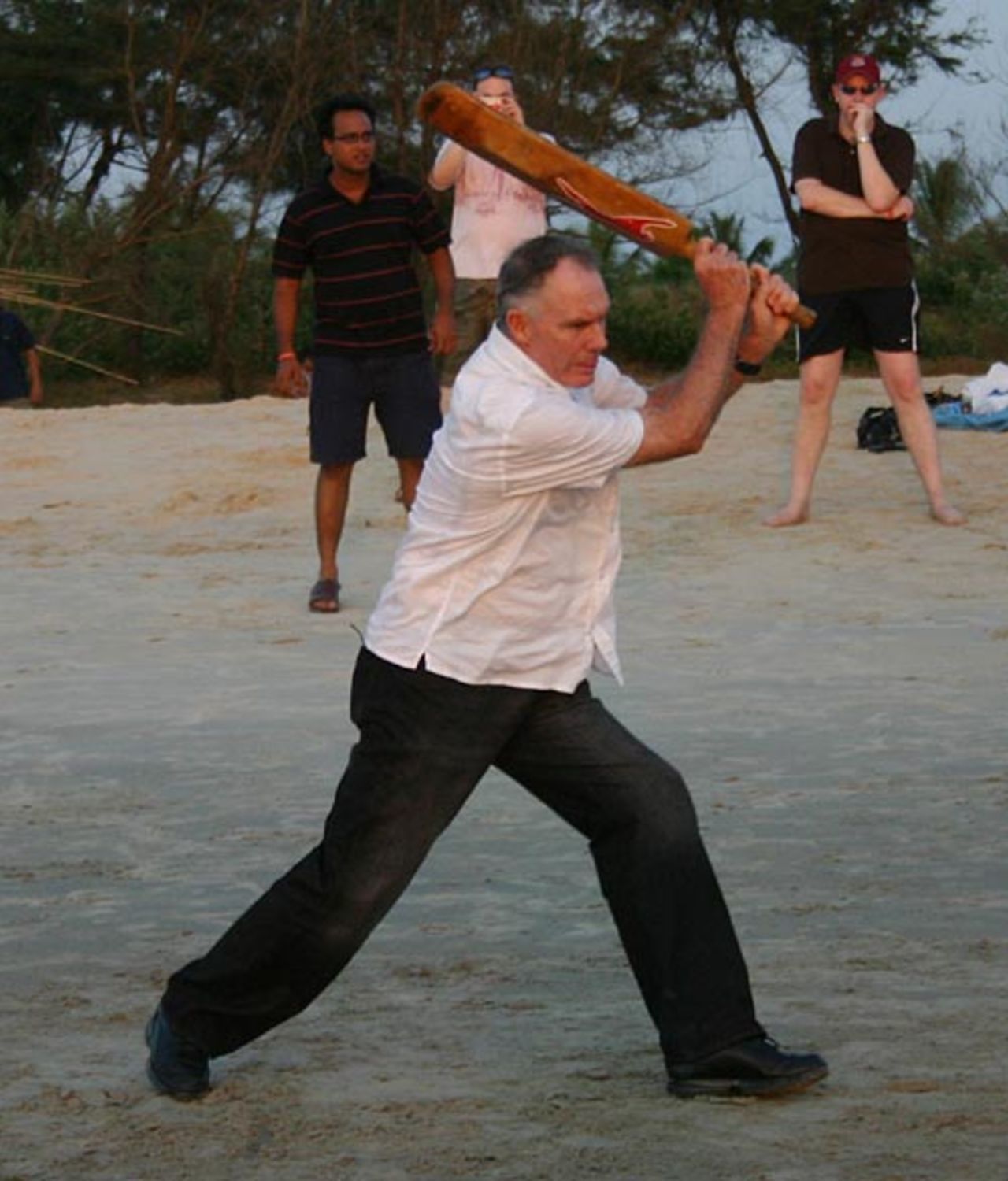 India's coach Greg Chappell plays beach cricket in Goa, November 9, 2006