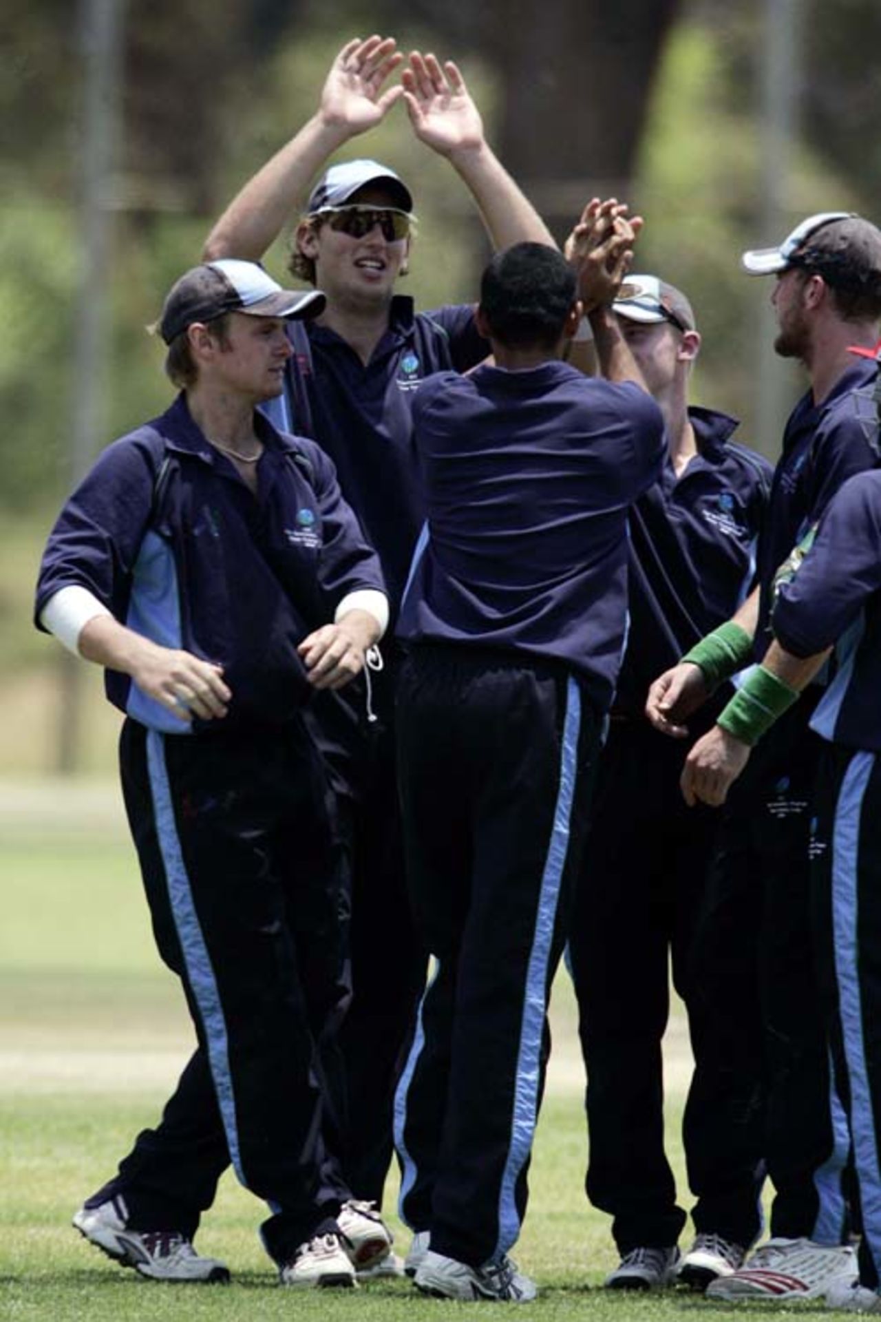 Porterfield, Dan van Bunge (capt), Alex Kervezee, John Mooney celebrate an Abdool Samad (facing away) wicket, ICC Winter Training Camp November 2006