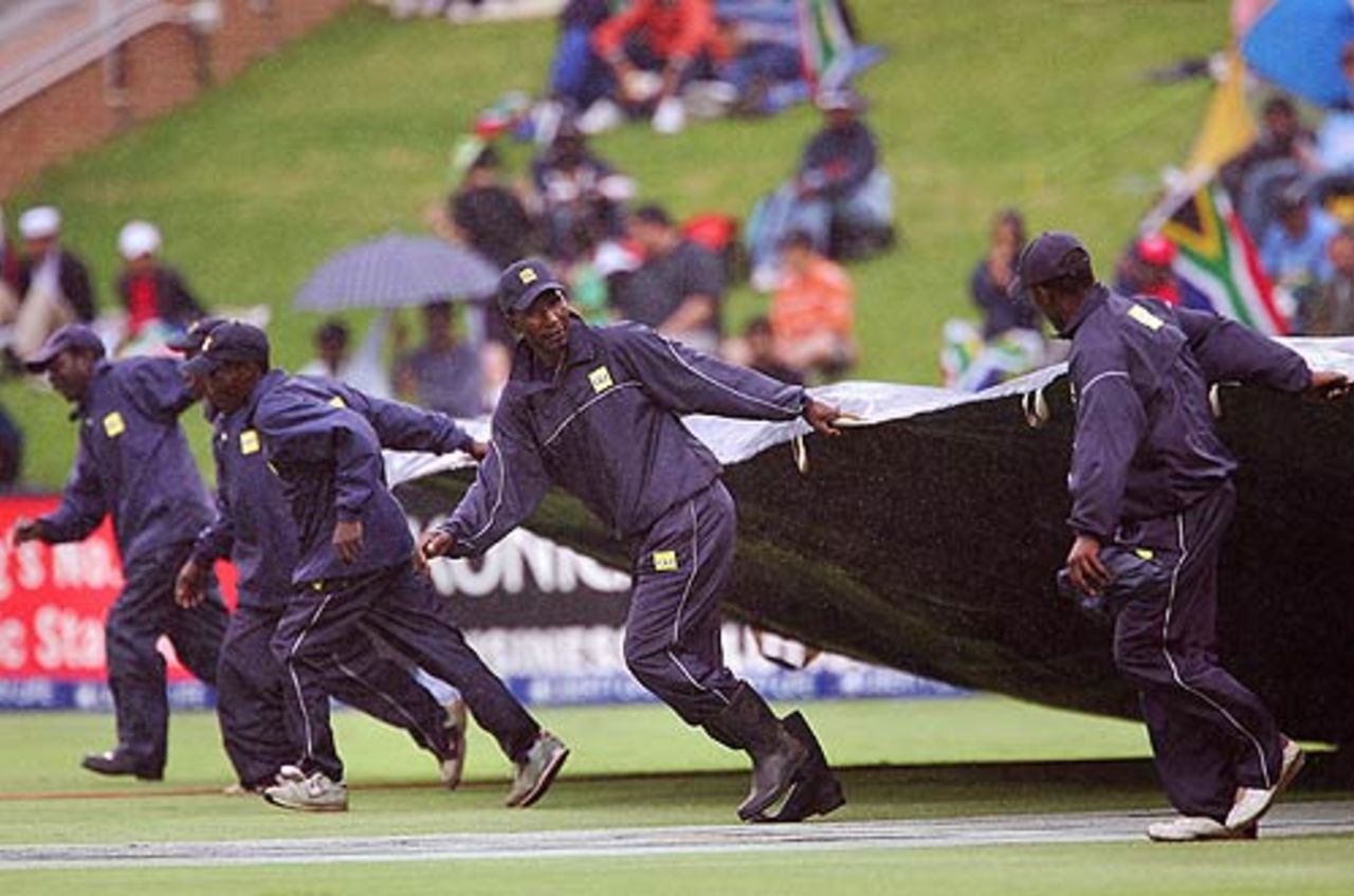Groundstaff at The Wanderers rush out with the covers, South Africa v India, 1st ODI, Johannesburg, November 19, 2006