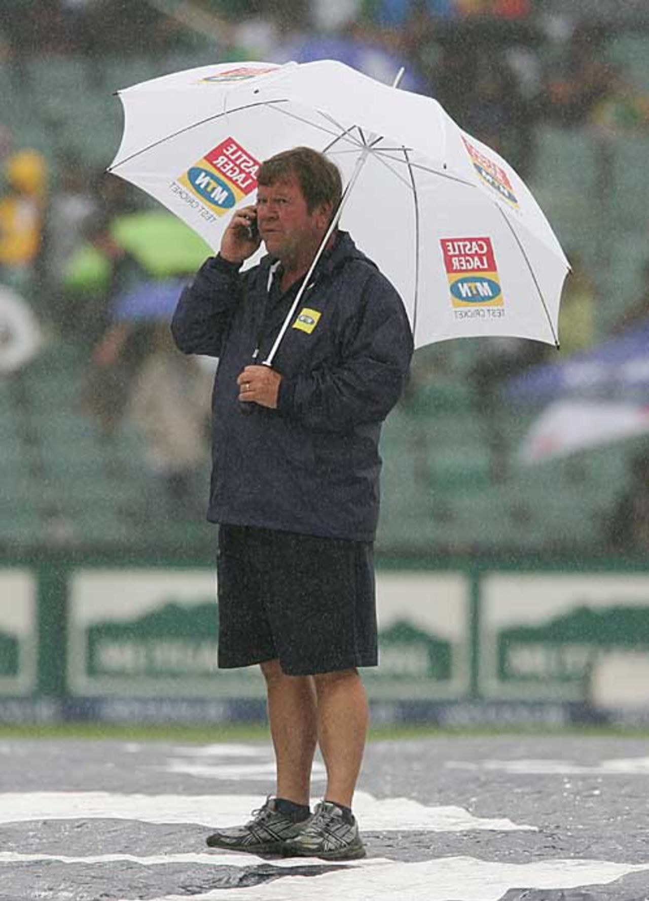 A member of the groundstaff takes cover at the Wanderers, South Africa v India, 1st ODI, Johannesburg, November 19, 2006