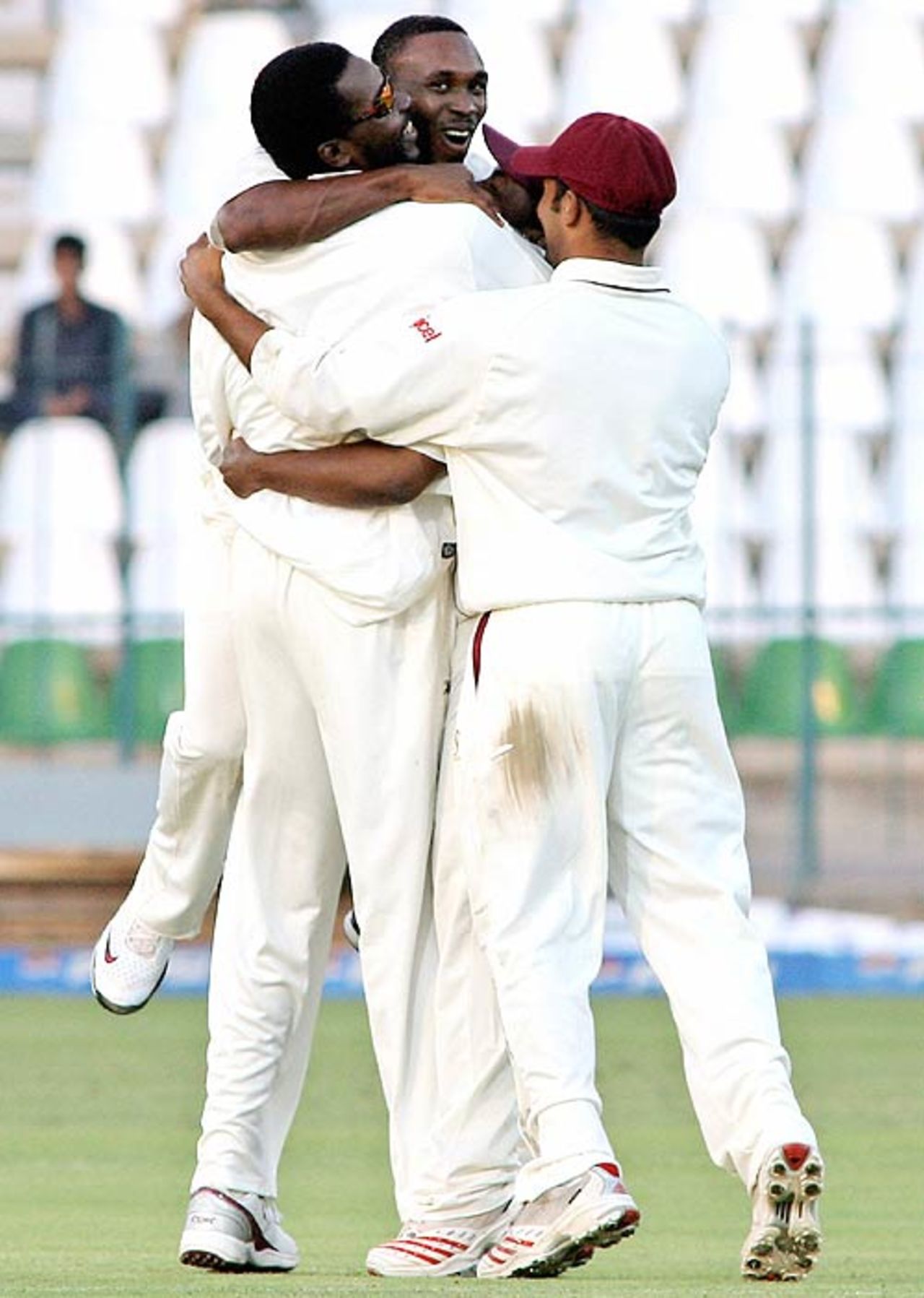 Dwayne Bravo and West Indies celebrate the dismissal of Imran Farhat , Pakistan v West Indies, 2nd Test, Multan, 1st day, November 19, 2006
