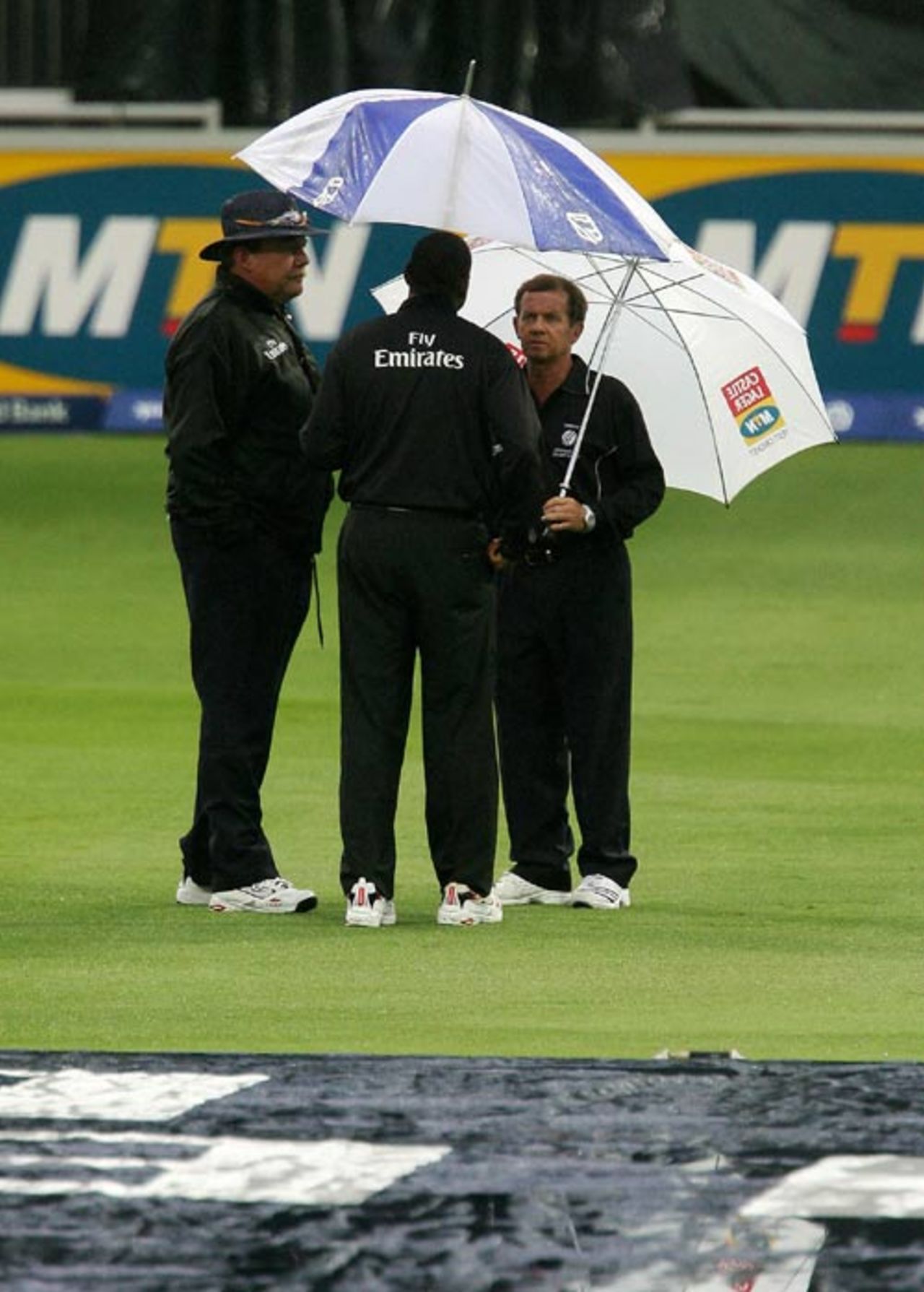 The umpires inspect the soggy outfield, South Africa v India, 1st ODI, Johannesburg, November 19, 2006