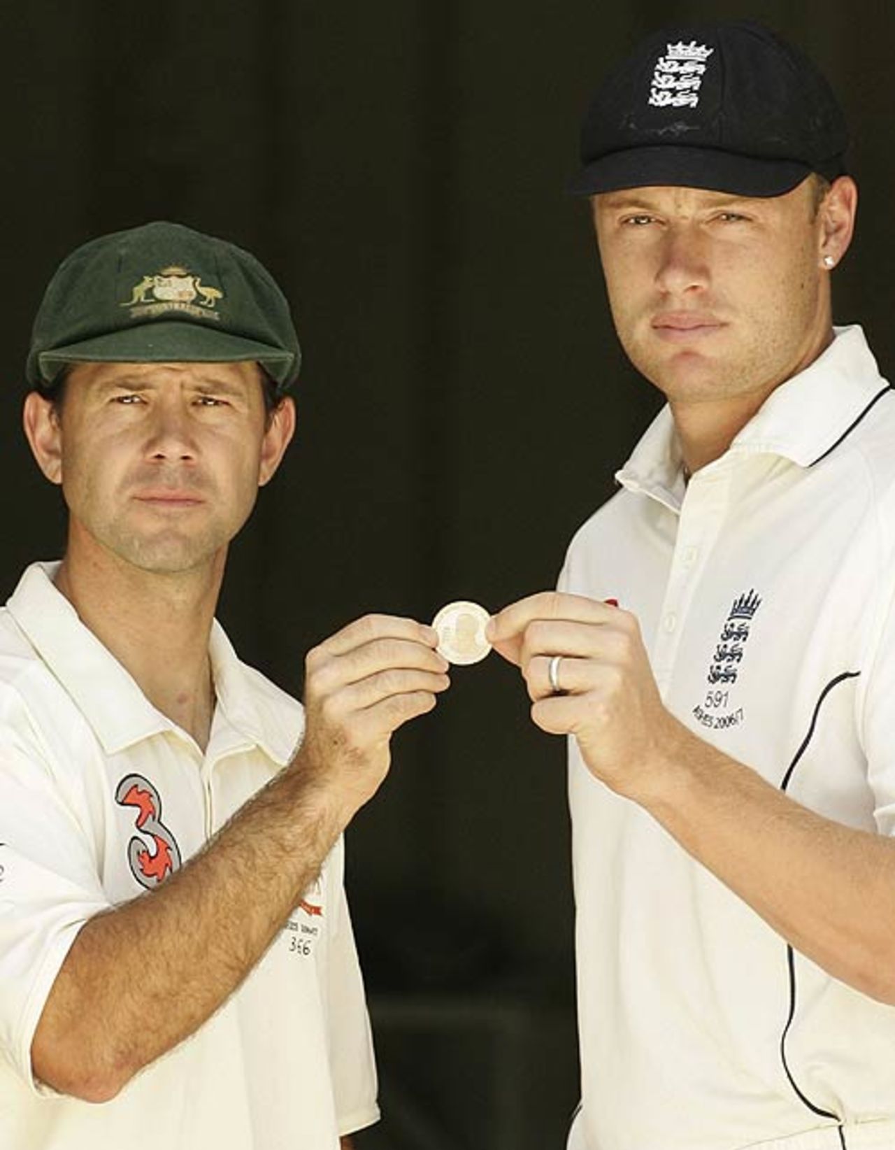 Ricky Ponting and Andrew Flintoff with one of the five coins specially minted for the toss before each Ashes Test, Brisbane, November 22, 2006