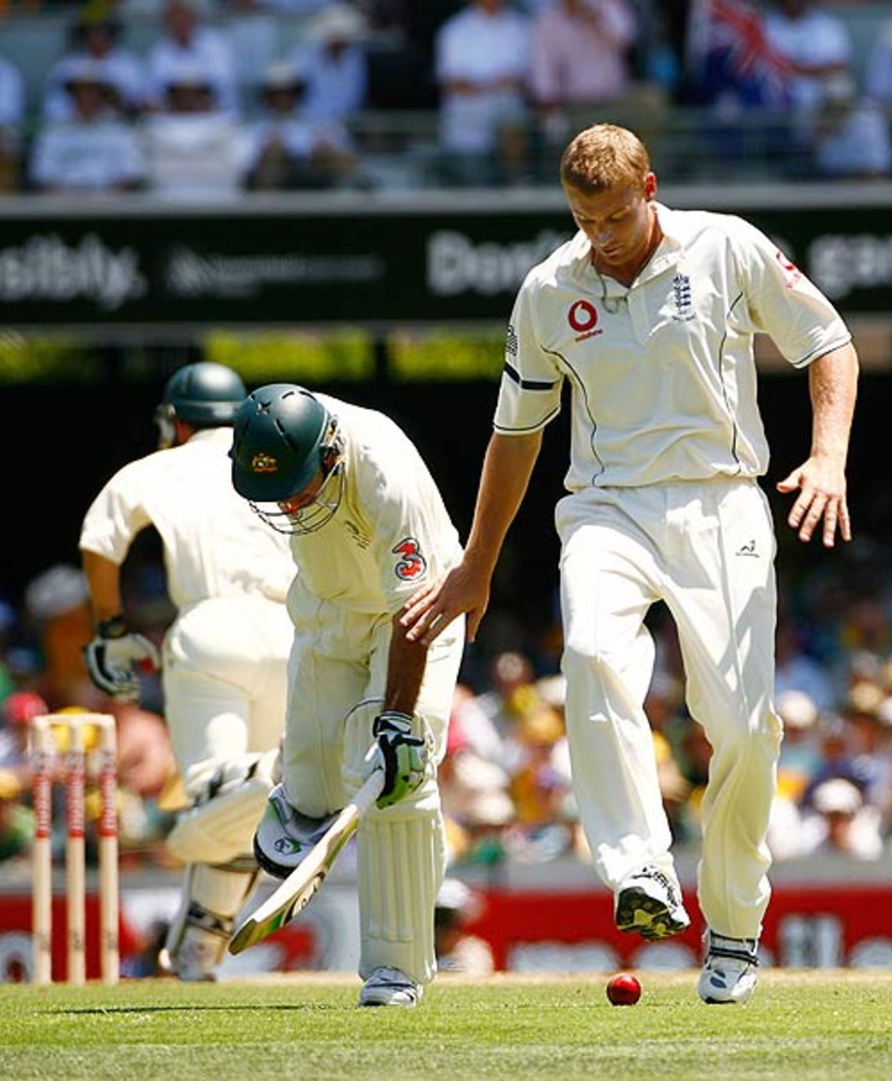 Andrew Flintoff tries some fancy footwork as Ricky Ponting completes a quick single, Australia v England, 1st Test, Brisbane, November 23, 2006