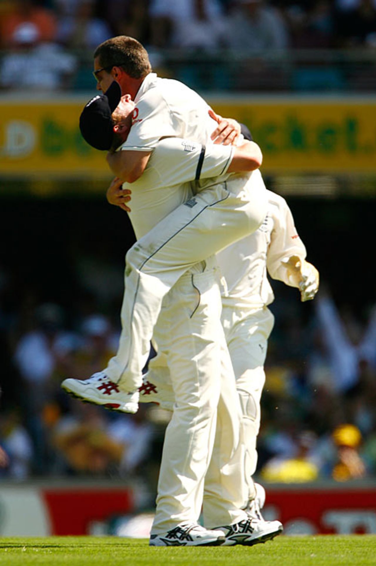 Ashley Giles is suffocated by Andrew Flintoff after removing Damien Martyn, Australia v England, 1st Test, Brisbane, November 23, 2006