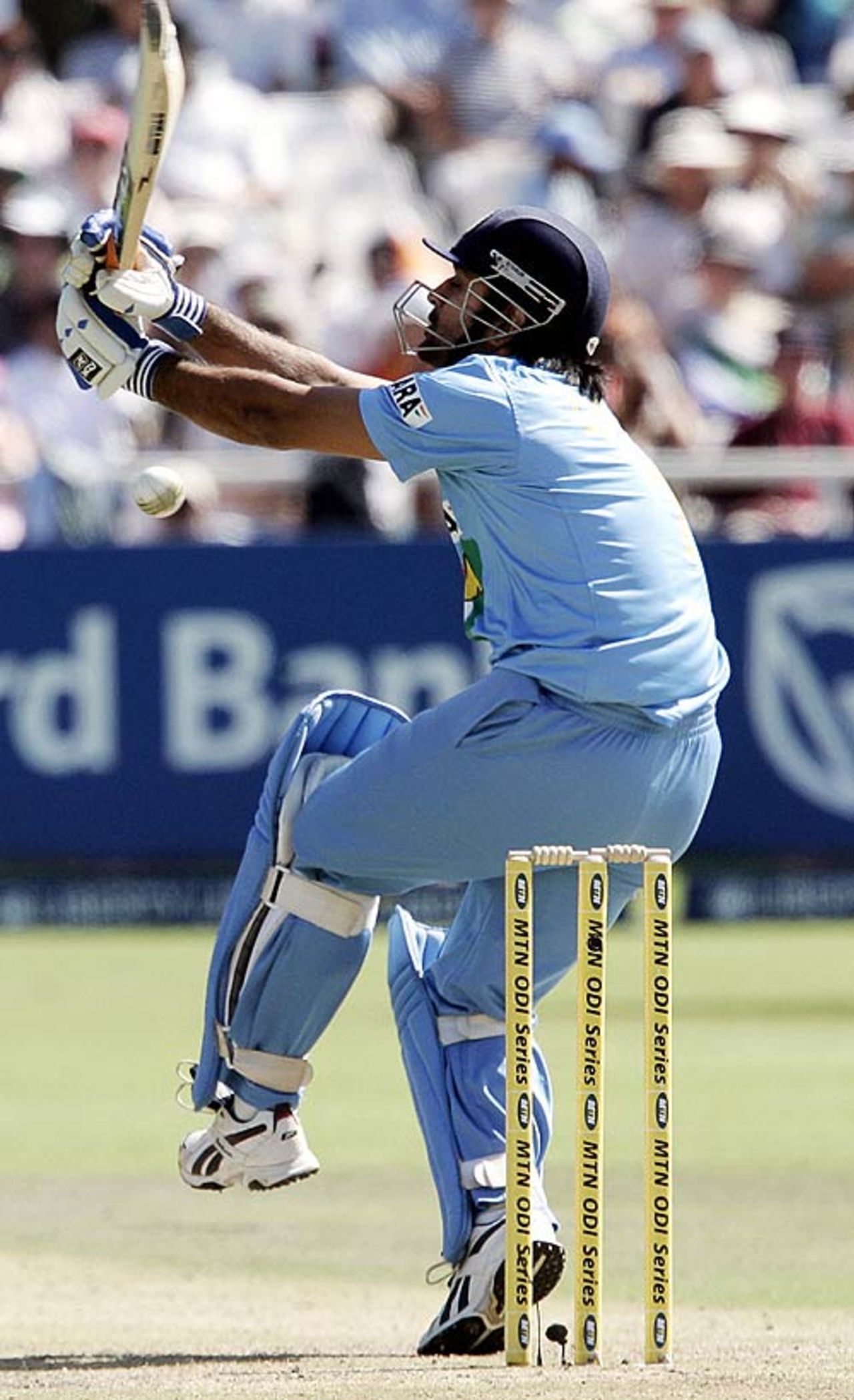 Mahendra Singh Dhoni unleashes a ferocious hoick for six, South Africa v India, 3rd ODI, Cape Town, November 26, 2006