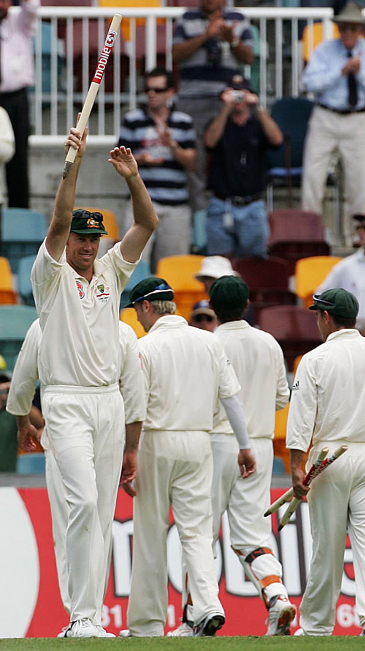 Glenn McGrath raises a stump in celebration after Australia trounce England at Brisbane, Australia v England, 1st Test, Brisbane, November 27, 2006