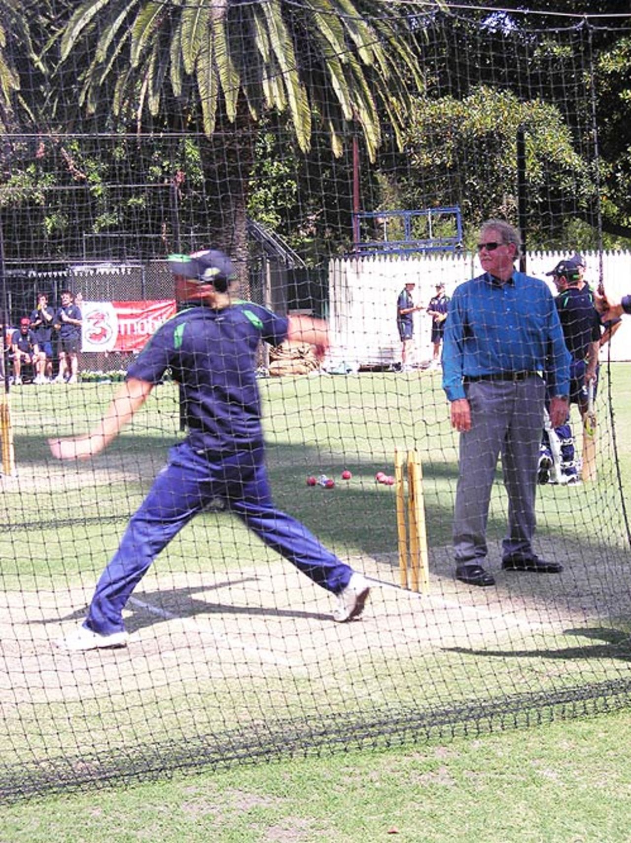 Terry Jenner watches on as Shane Warne bowls during Australia's net session, Adelaide, November 30, 2006