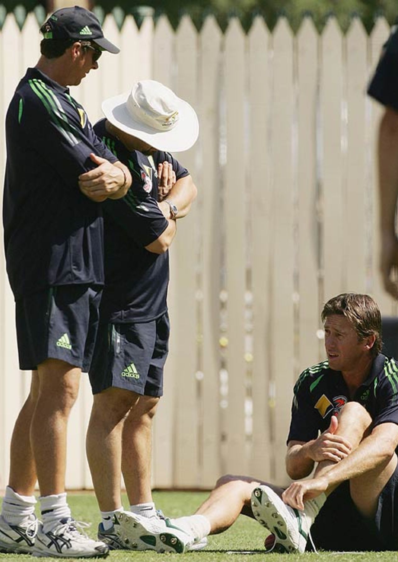 Glenn McGrath talks to bowling coach Troy Cooley and physiotherapist Alex Kountouris at Australia's net session, Adelaide, November 30, 2006