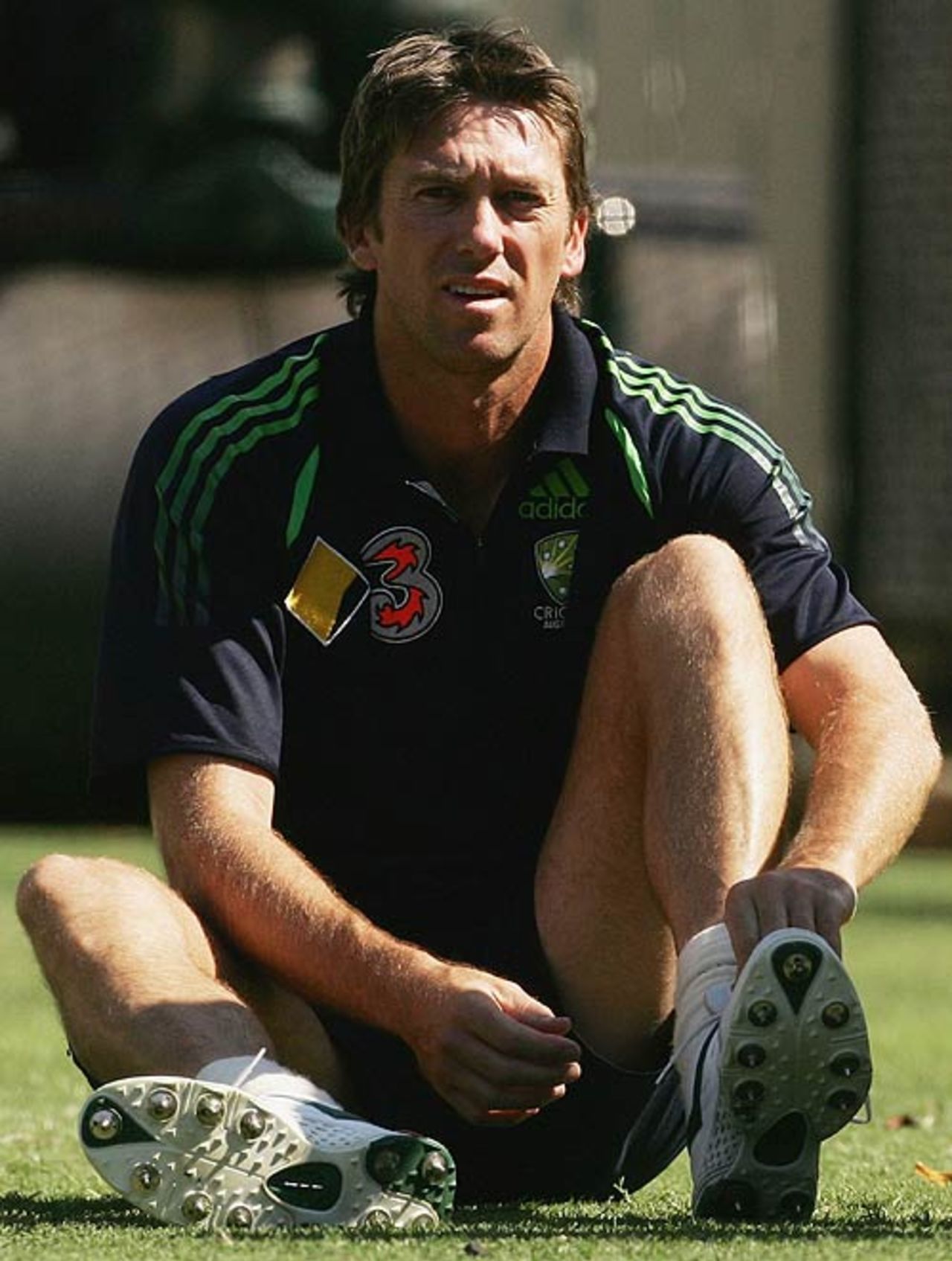 Glenn McGrath adjusts the shoe on his injured left foot during Australia's net session, Adelaide, November 30, 2006