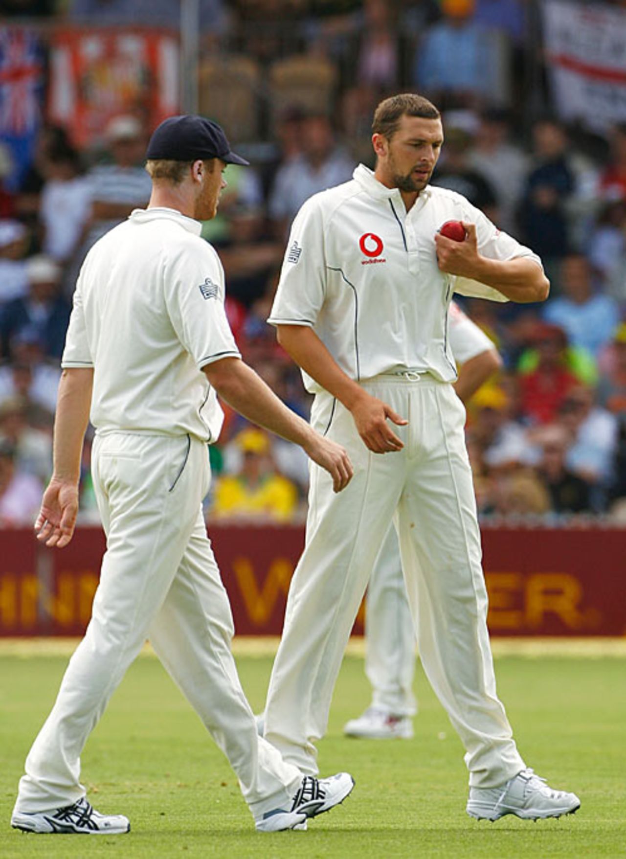 Andrew Flintoff gives Steve Harmison his first bowl of the 2nd Test, Australia v England, 2nd Test, Adelaide, December 3, 2006