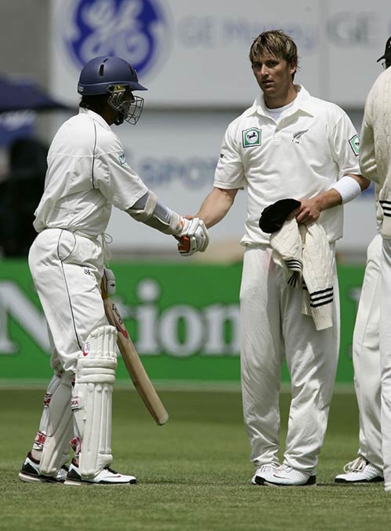 Shane Bond congratulates Kumar Sangakkara on his hundred, New Zealand v Sri Lanka, 1st Test, Christchurch, 3rd day, December 9, 2006
