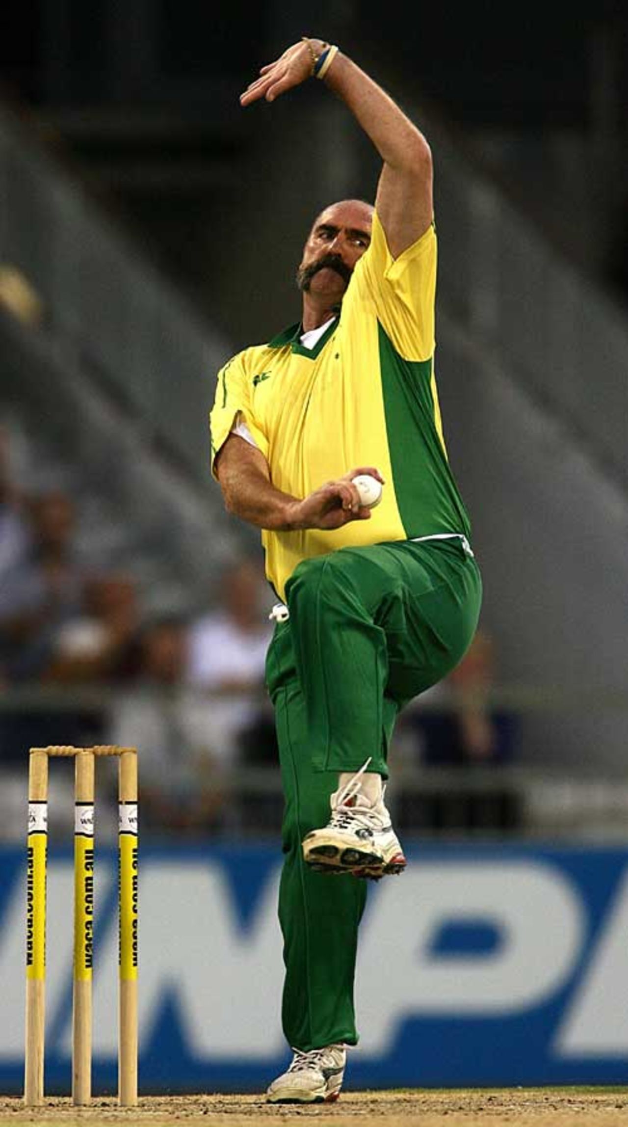 Merv Hughes bounds up to the crease for Australia in the Legends Twenty20, Australia v England, Perth, December 12, 2006