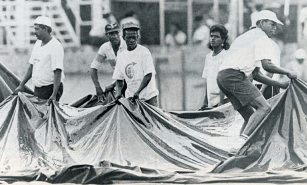 Groundstaff pull tarpaulins into place, West Indies v England, 3rd Test, Trinidad, March 28, 1990