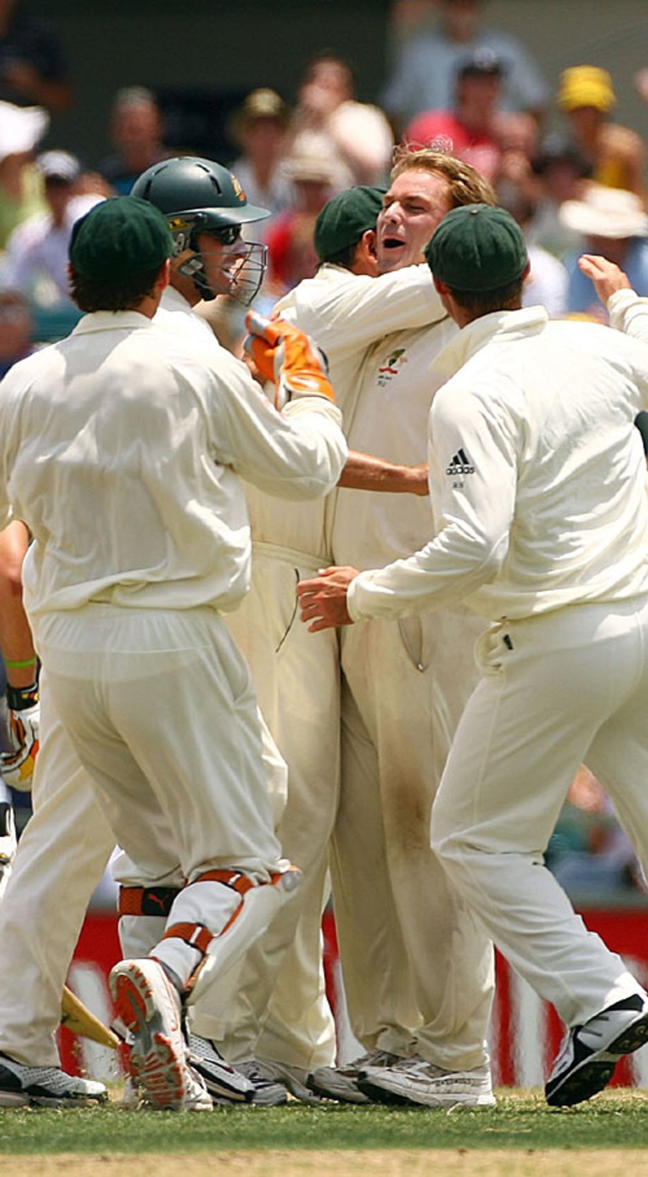 Shane Warne is mobbed by his team-mates after removing Andrew Flintoff, Australia v England, 3rd Test, Perth, December 18, 2006
