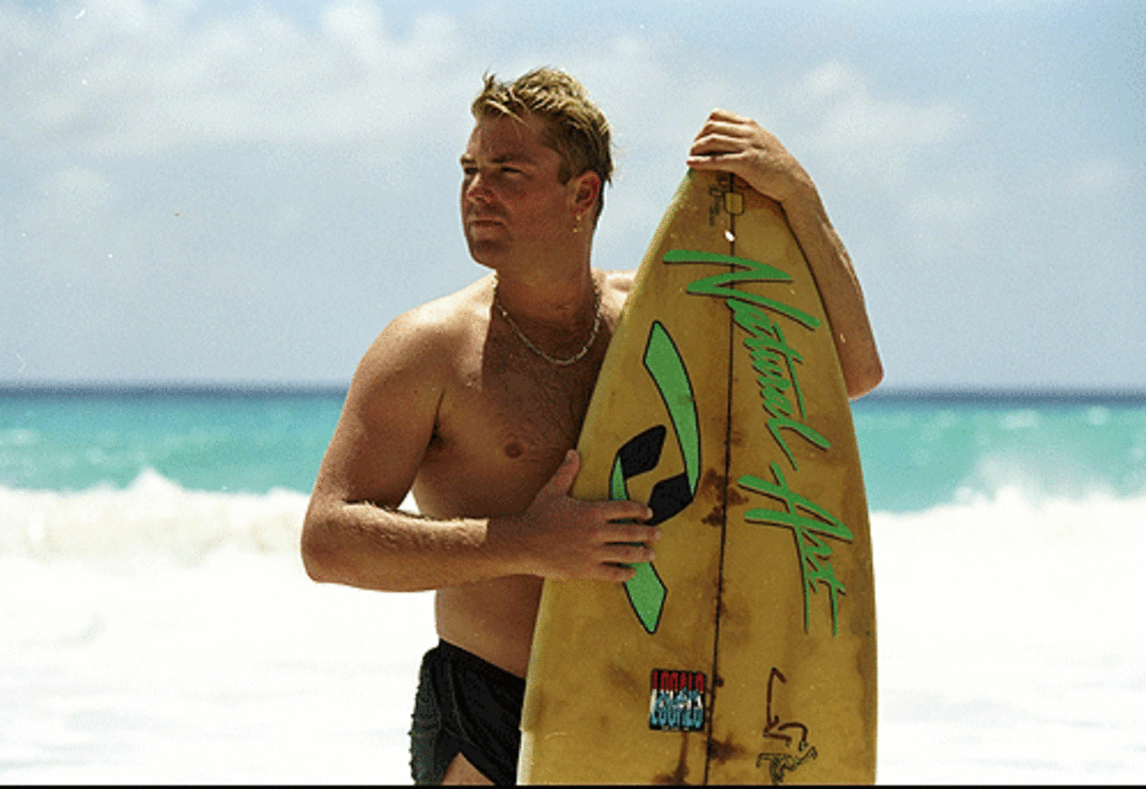 Shane Warne goes surfing during Australia's tour to the West Indies, Barbados, April 1, 1995