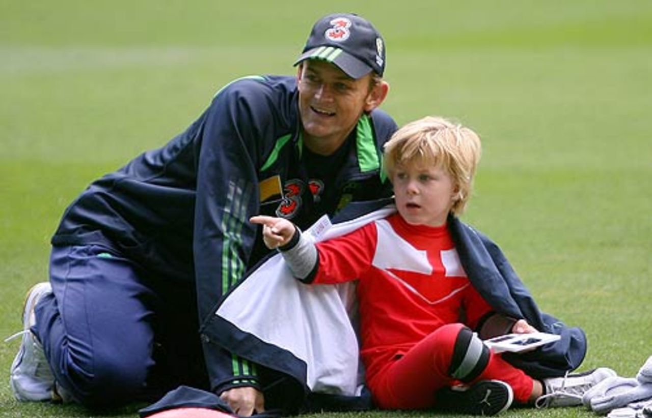 Adam Gilchrist plays with his son Harry on Christmas day, December 25, 2006