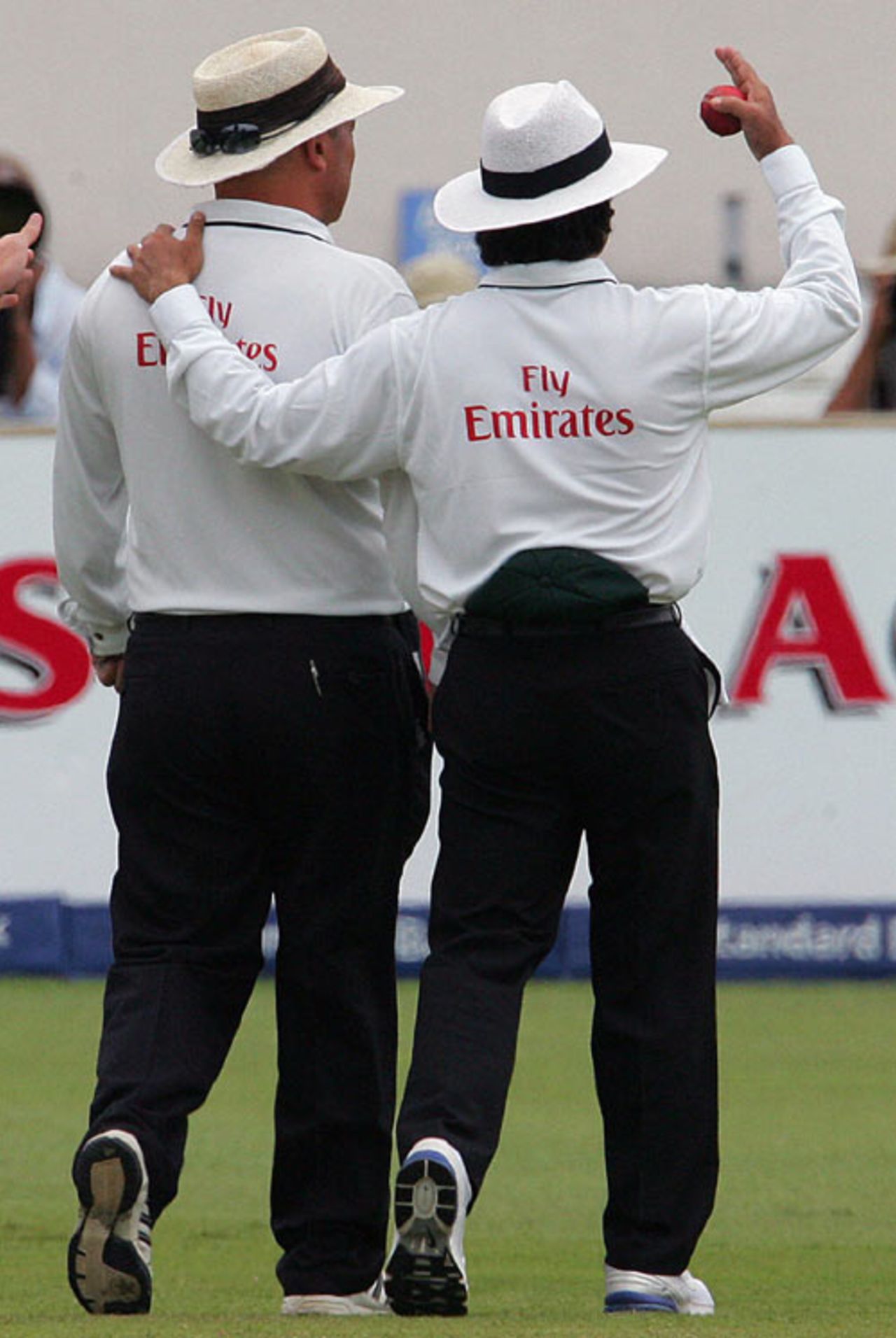 Asad Rauf helps Mark Benson off the field after he complained of heart palpitations, South Africa v India, 2nd Test, Durban, December 28, 2006 