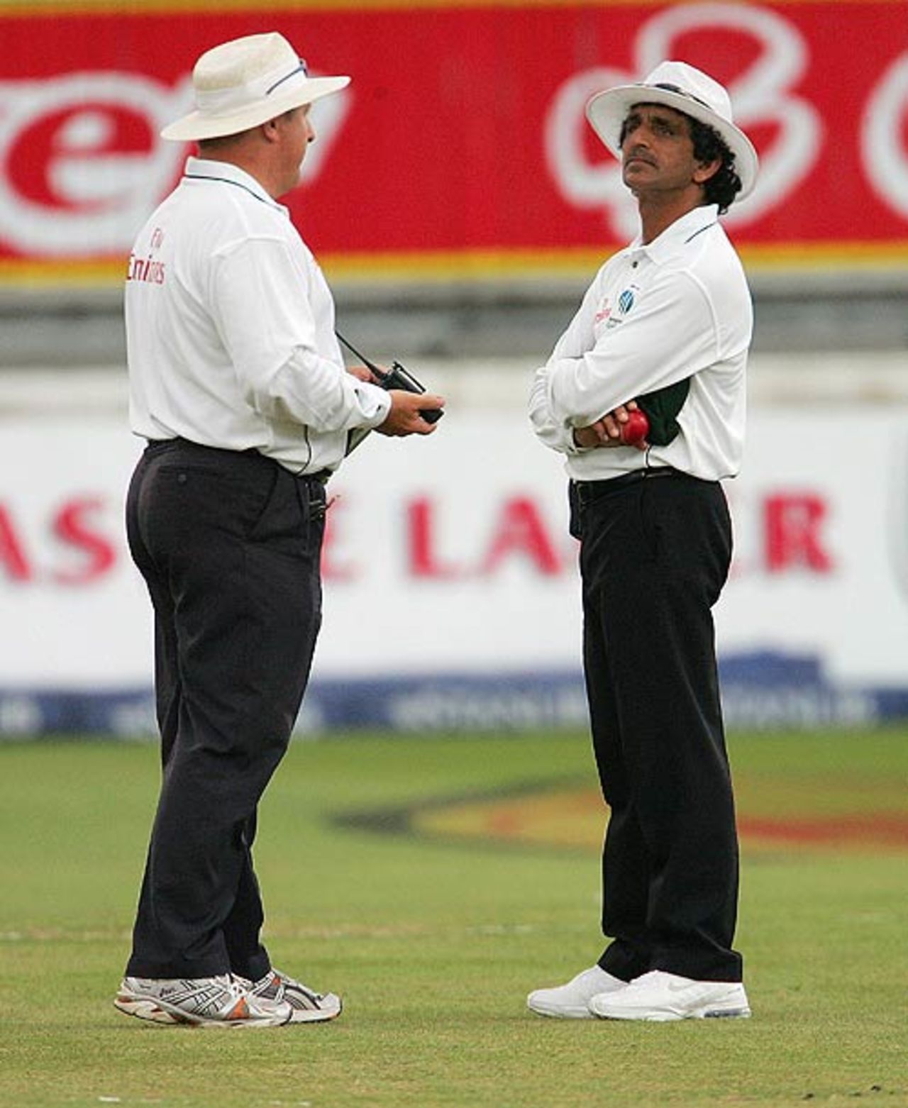 Umpires Ian Howell and Asad Rauf in discussion about the fading light at  Kingsmead, South Africa v India, 2nd Test, Durban, 5th day, December 30, 2006